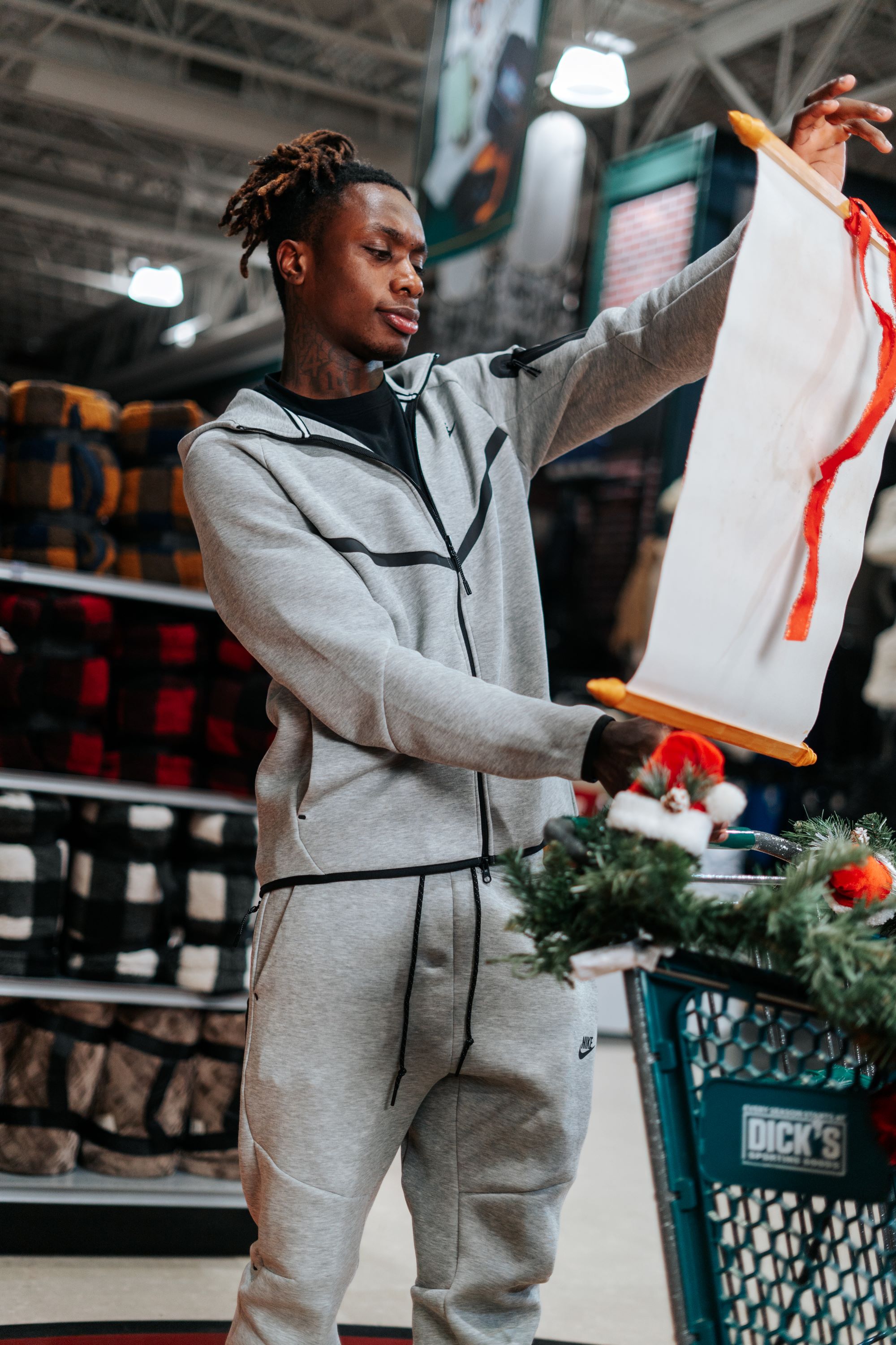 Xavier Worthy checking his holiday shopping list