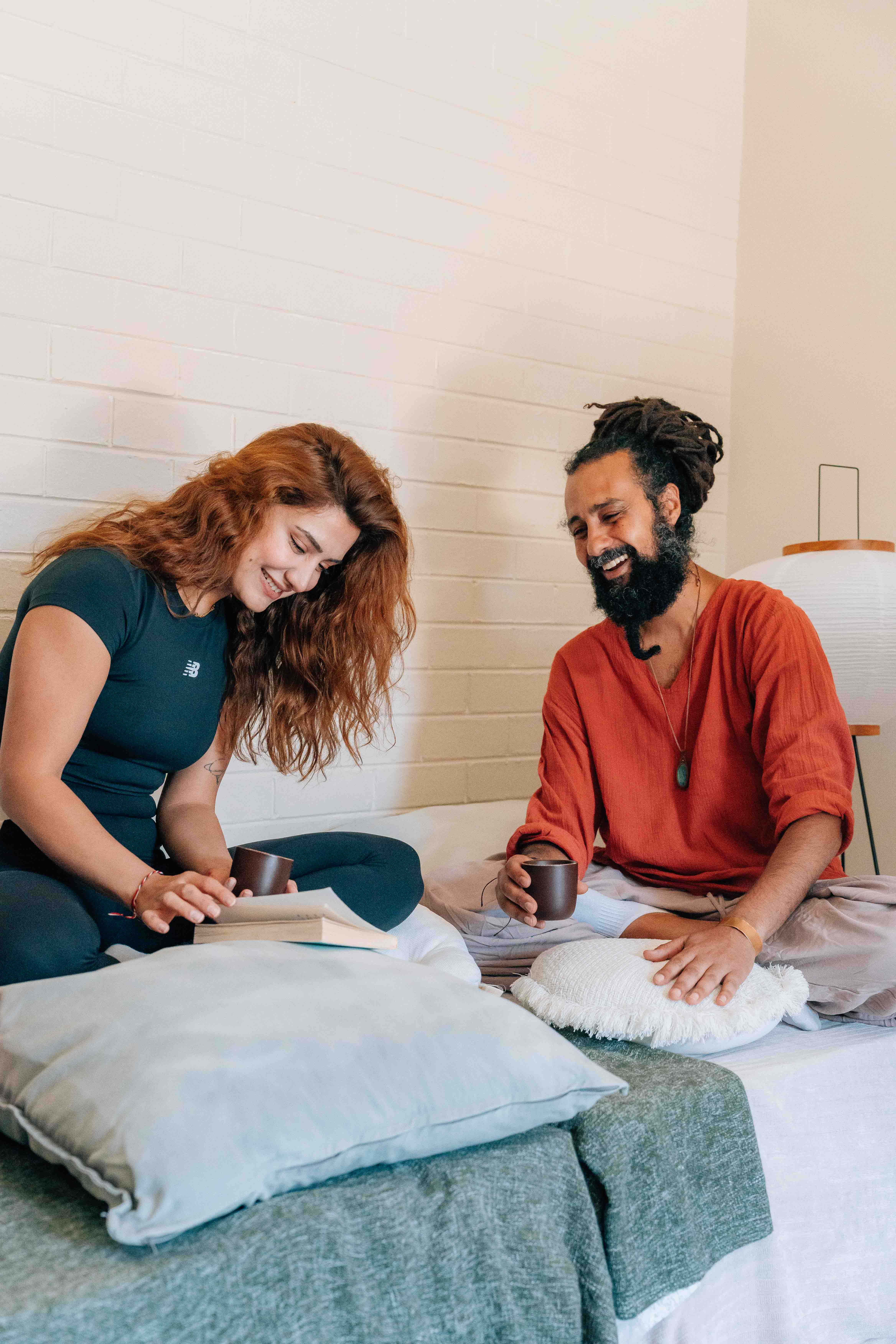 man in black long sleeve shirt sitting by the table