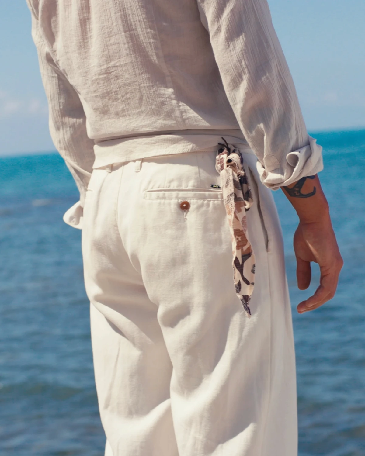 two womans wearing white jackets using the hood