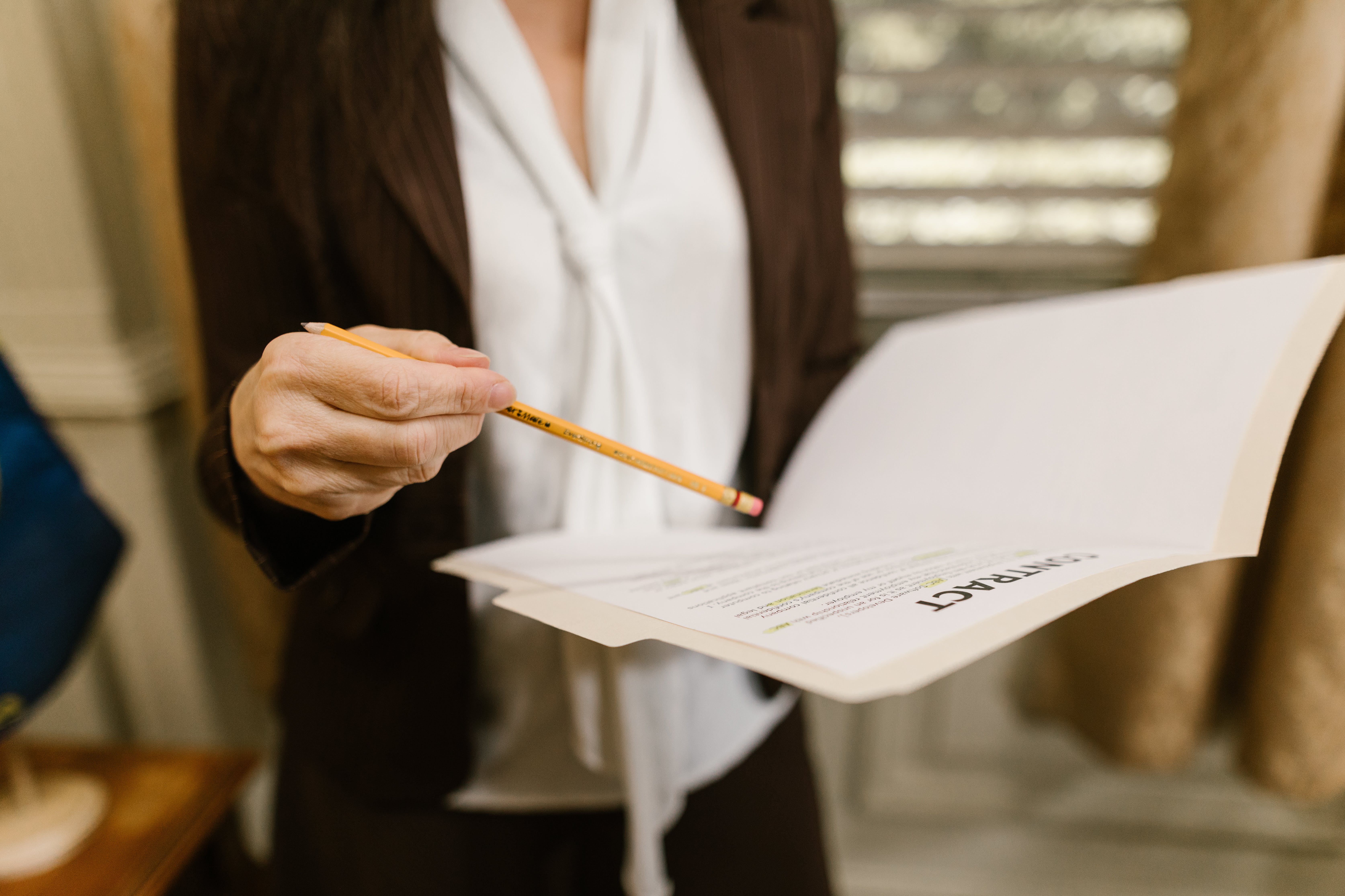 Woman holding a mortgage loan contract