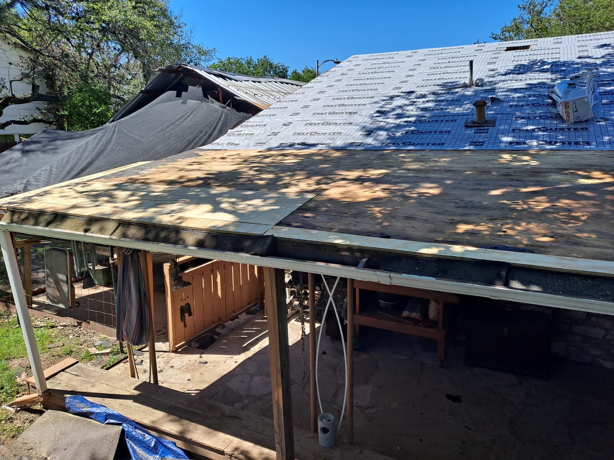 Roof deck and underlayment during installation. The visible product is an example from our work, not a recommendation for every roof.