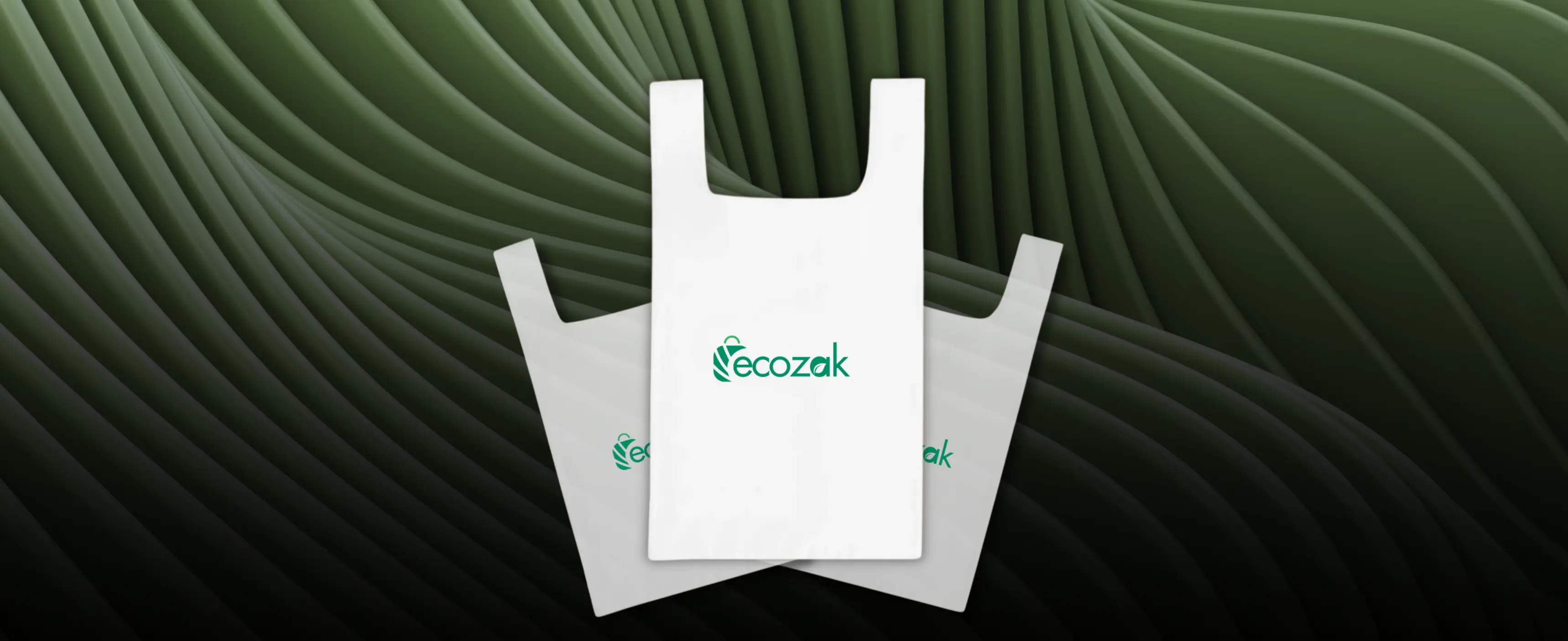 Aerial view of a winding road cutting through rocky terrain with patches of grass.