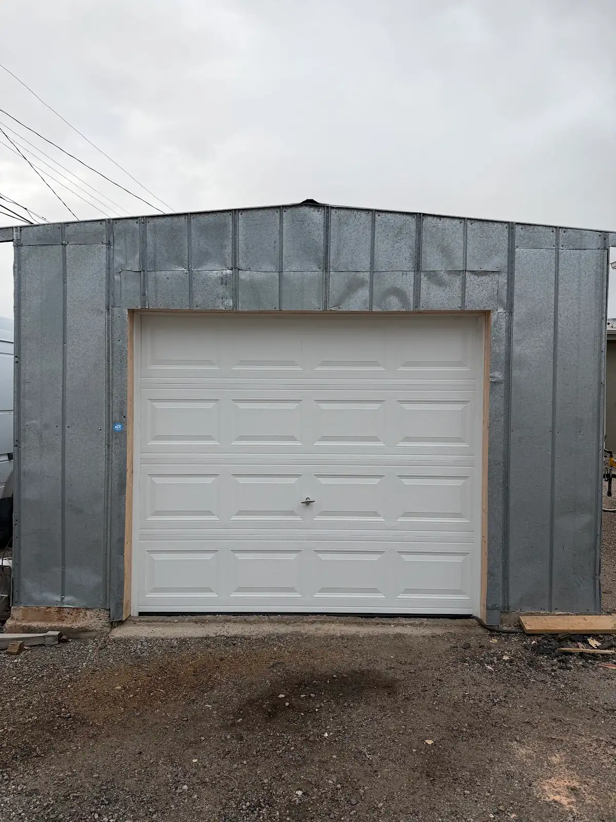 New white garage door installed in metal building. Garage door company Rio Rancho.