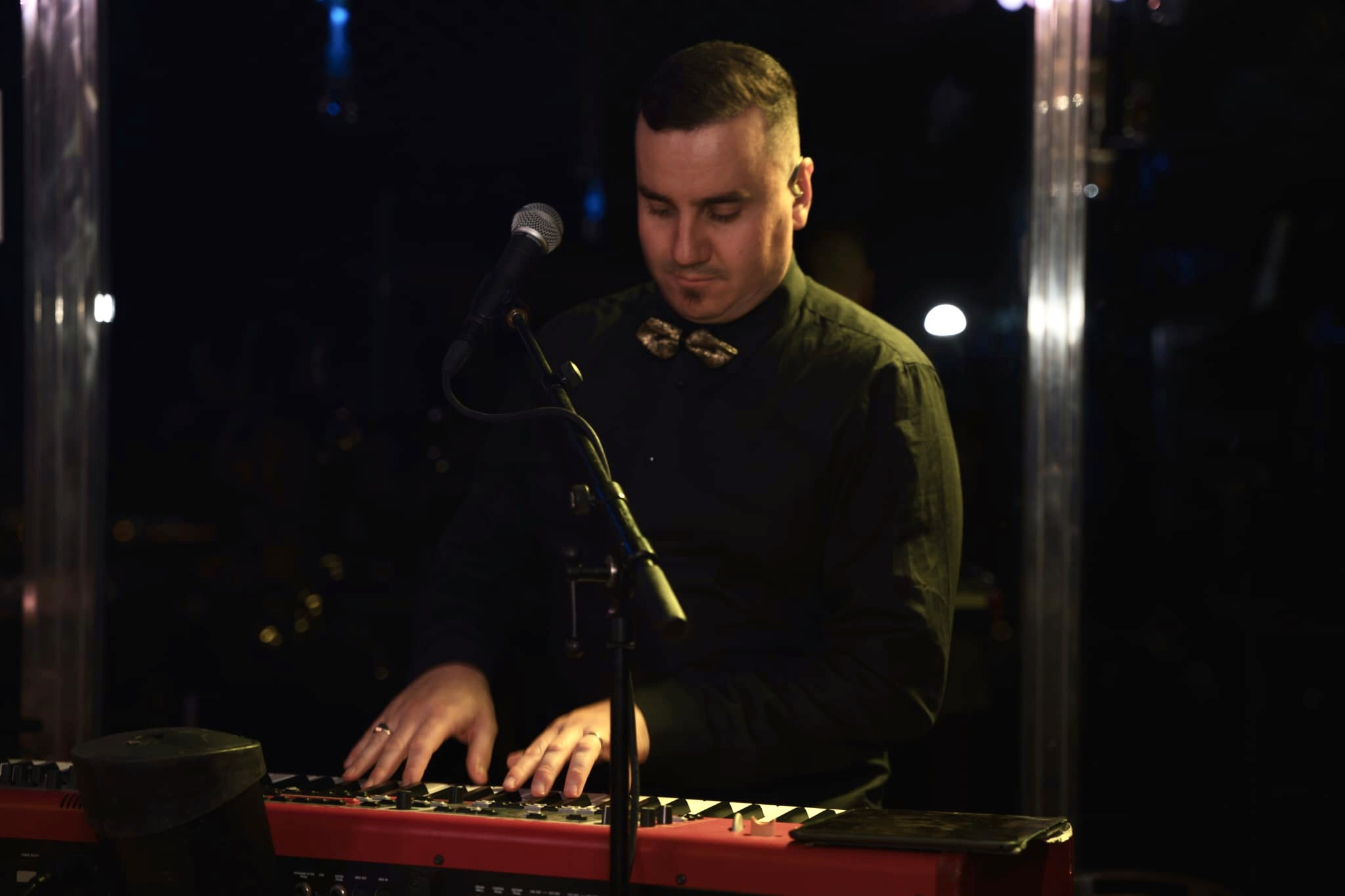 a man standing in front of a keyboard