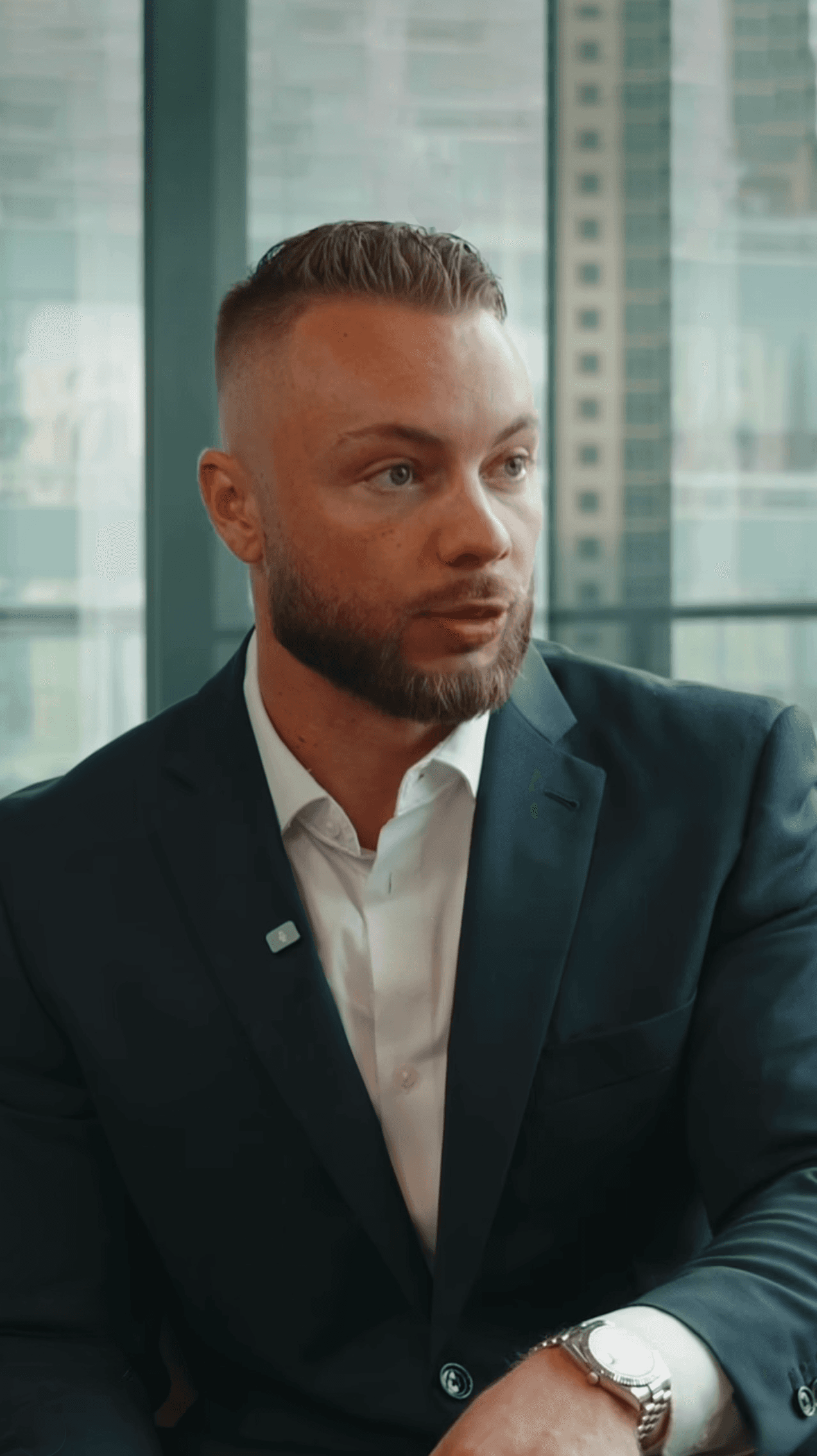 Woman in pink sweater indoors.