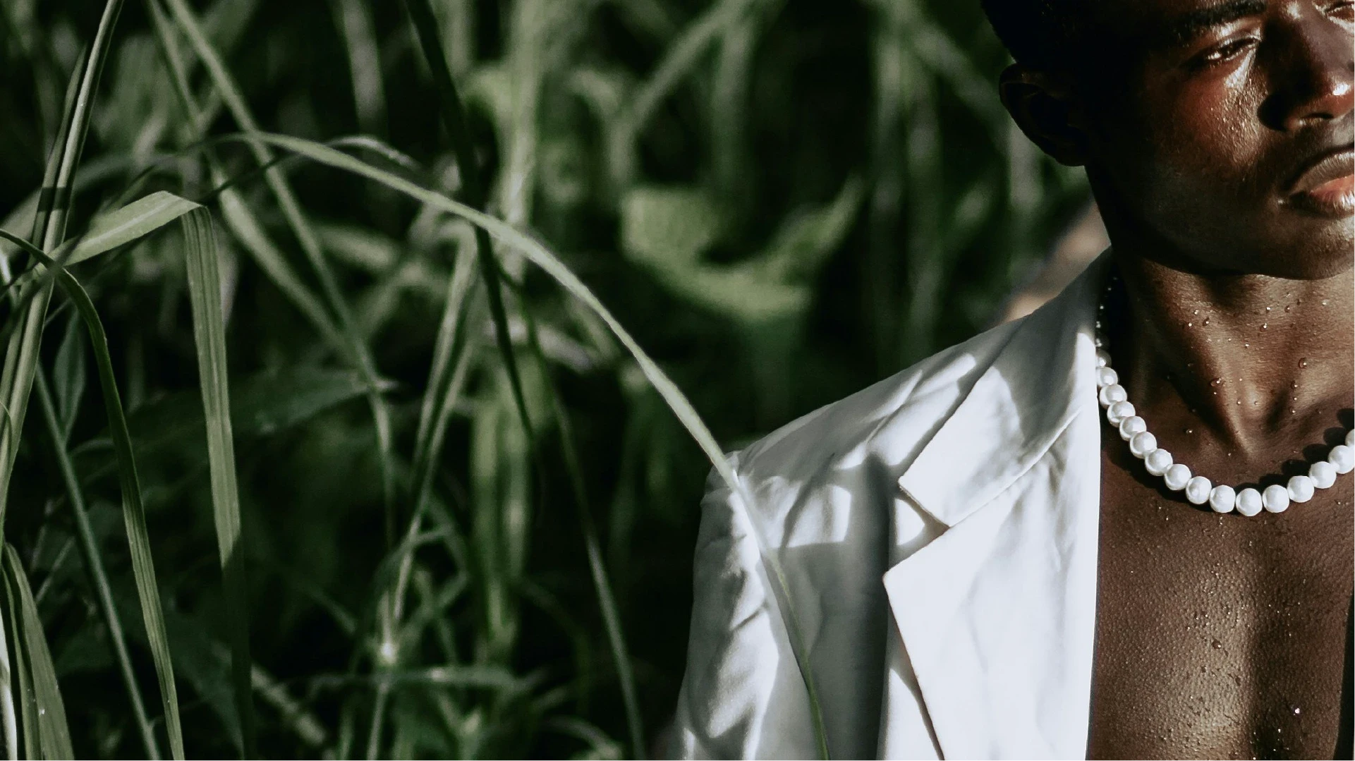 stylish man with exotic forest in background