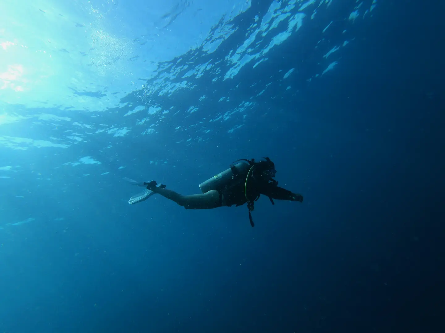 Diver in the open water space at blue lagoon bali