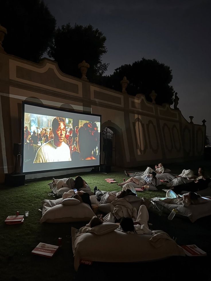 people walking on sidewalk near high rise buildings during daytime