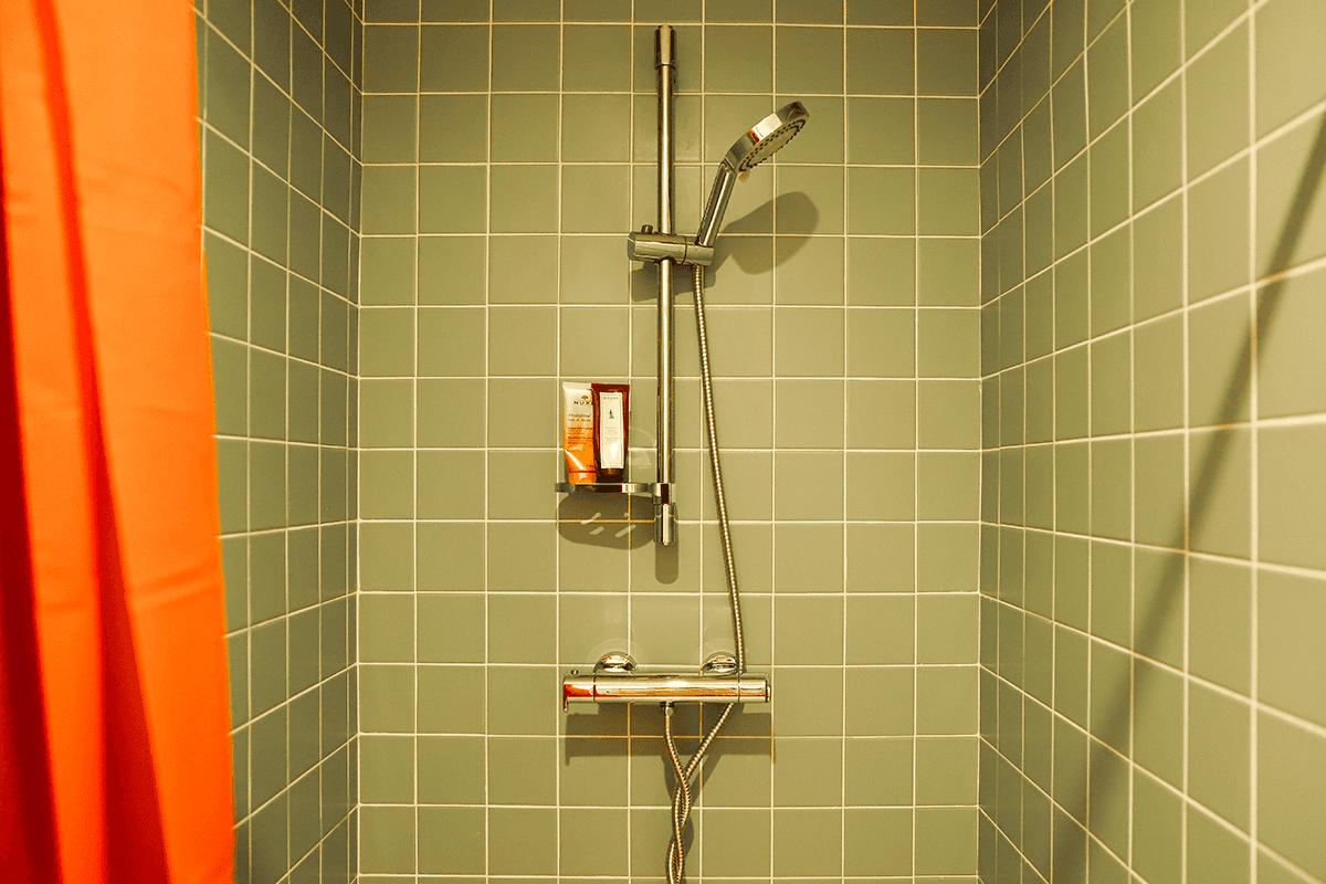 Streetside billboard with flyposters of the Batch.Works brand and illustrations