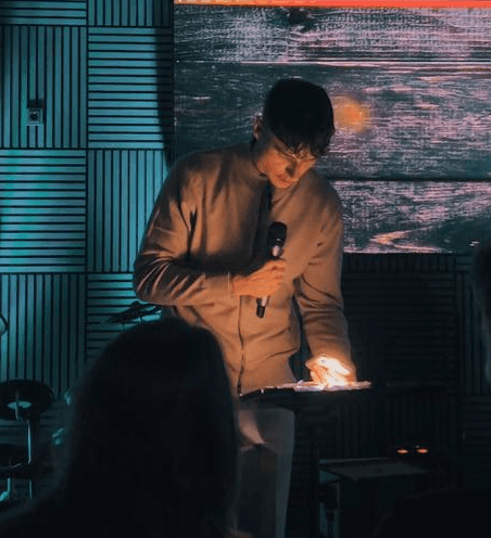 smiling woman wearing white and black pinstriped collared top