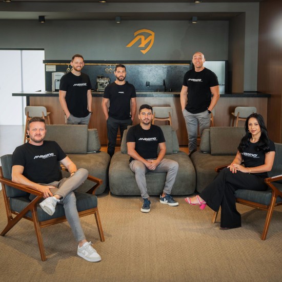 a person wearing a helmet and a cloak with a plain gradient background