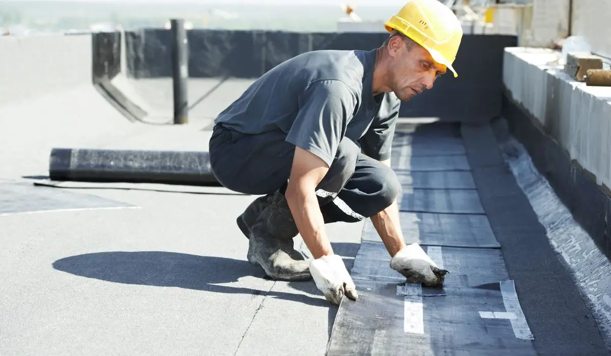 EPDM roofing applied by professional on flat commercial roof during installation in Burr Ridge, Illinois.