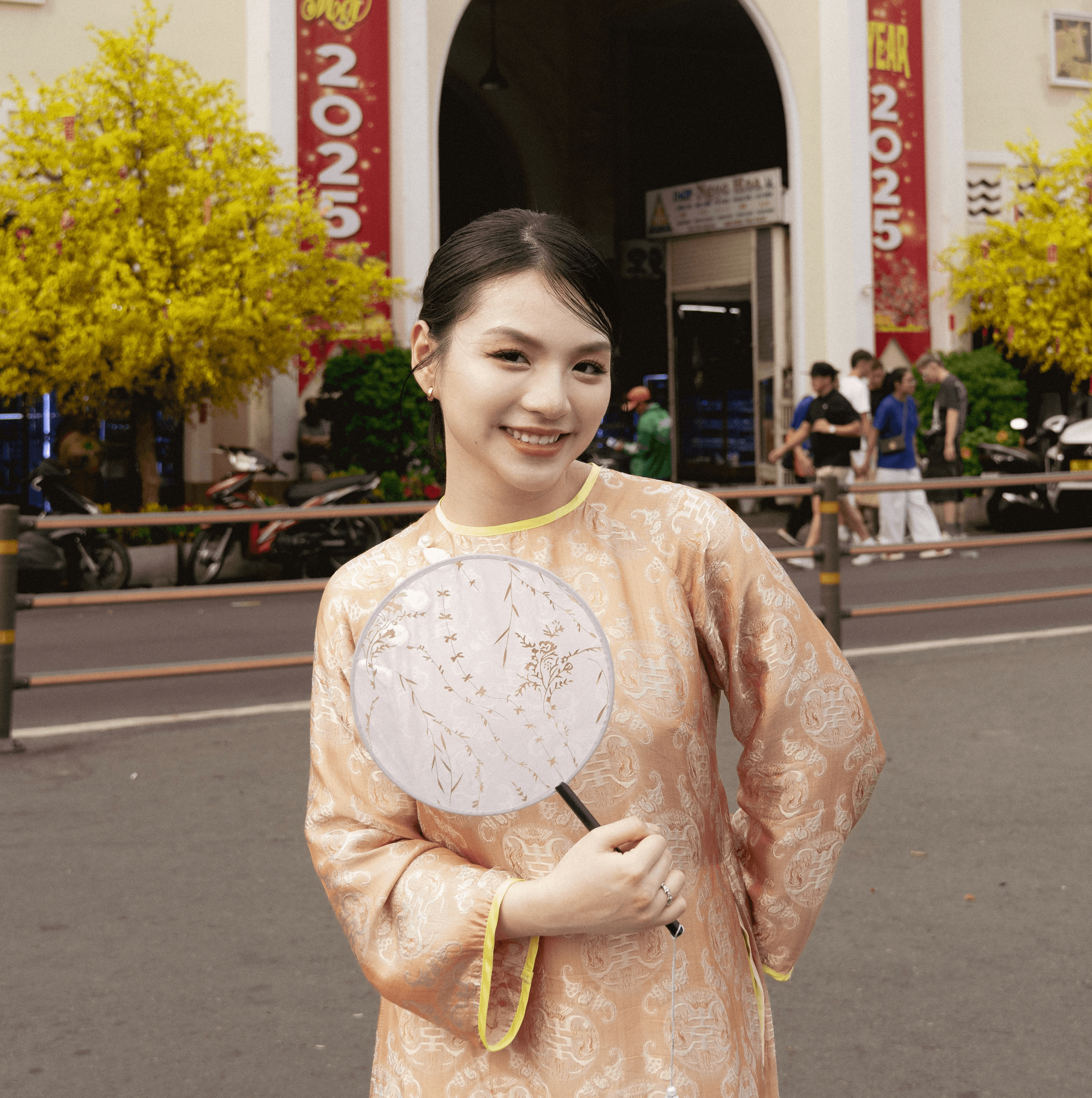 Wearing an áo dài
