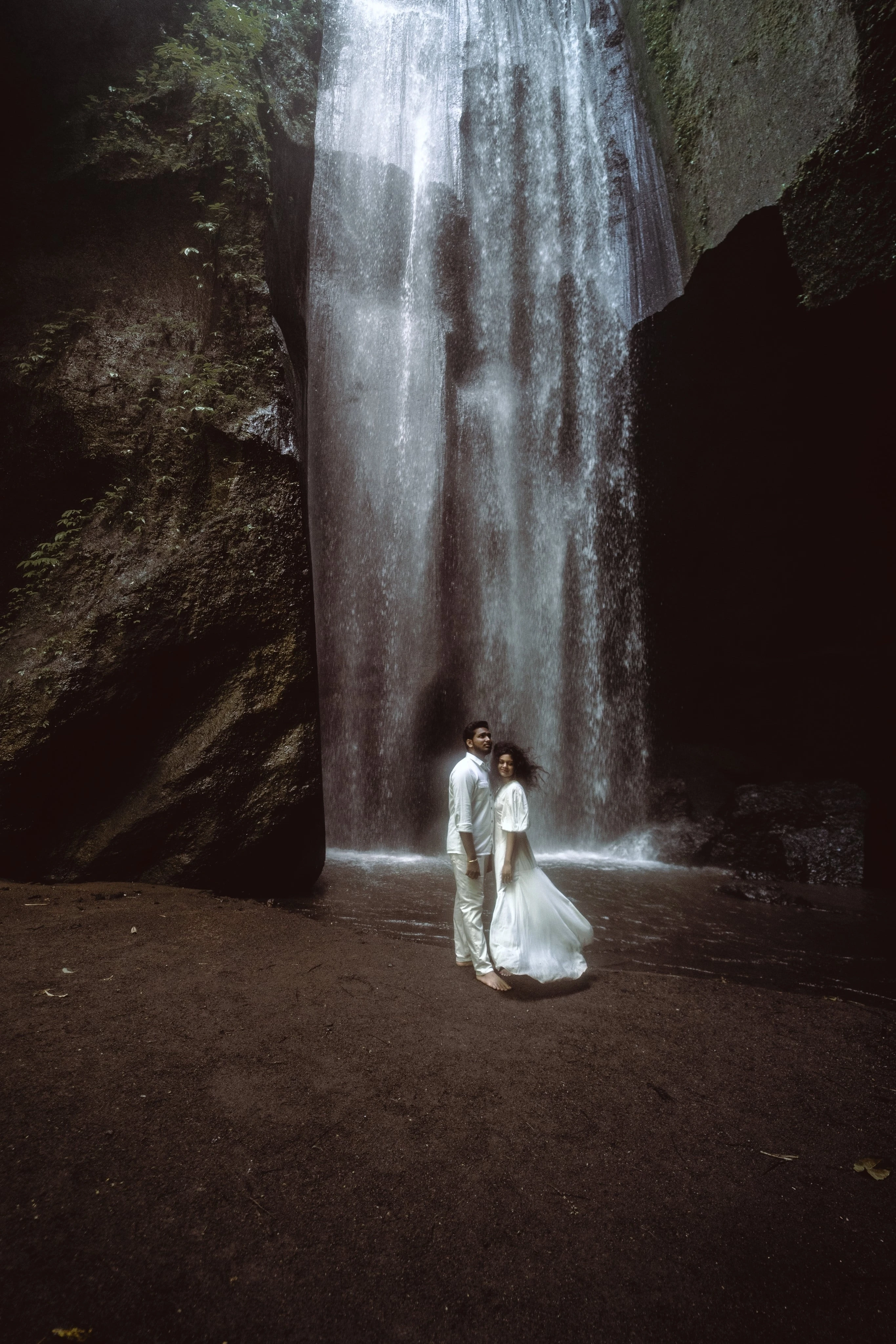 Fine Art Wedding Photography in Hyderabad by Out of The Blues – A couple sharing heartfelt moments amidst stunning island landscapes.