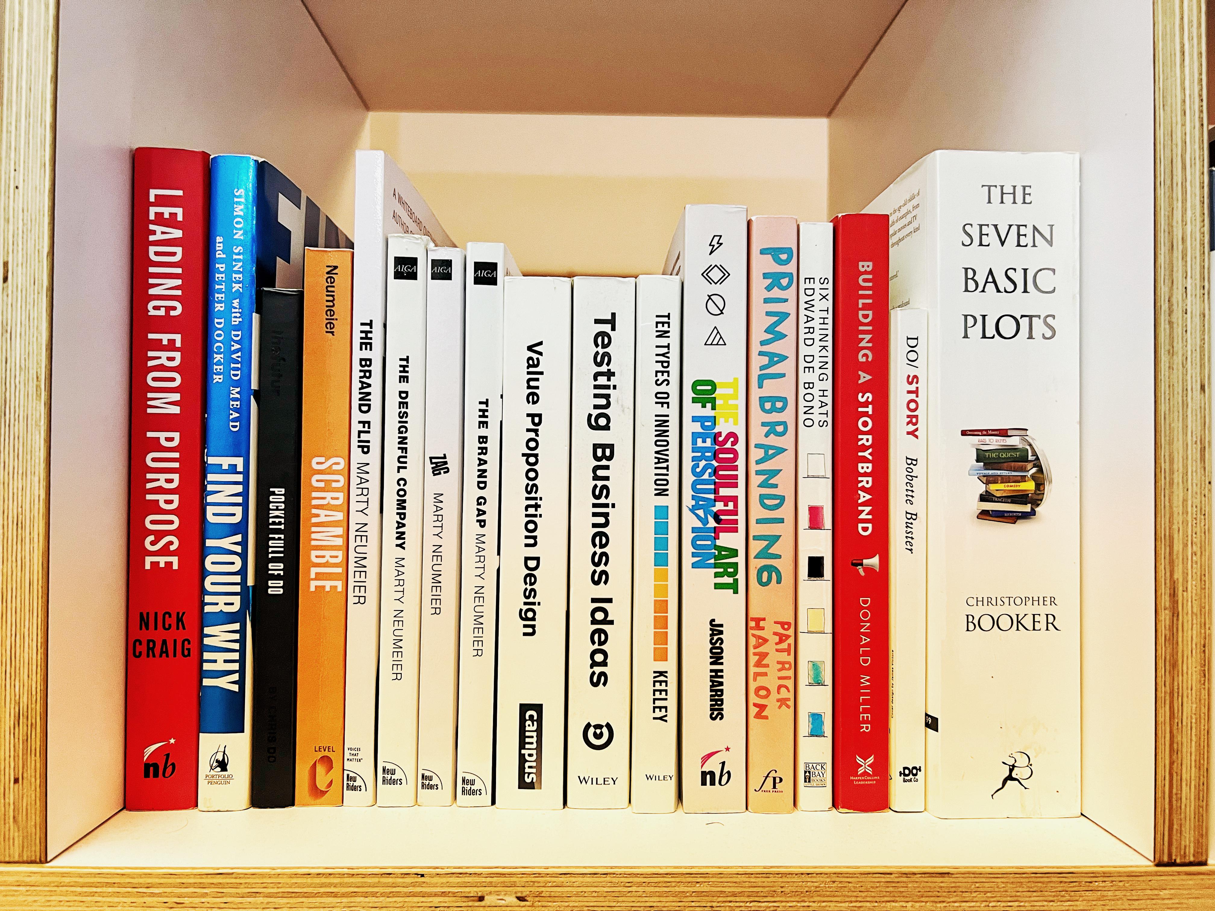 Bookshelf featuring brand strategy and storytelling classics that influence the StoryOS methodology