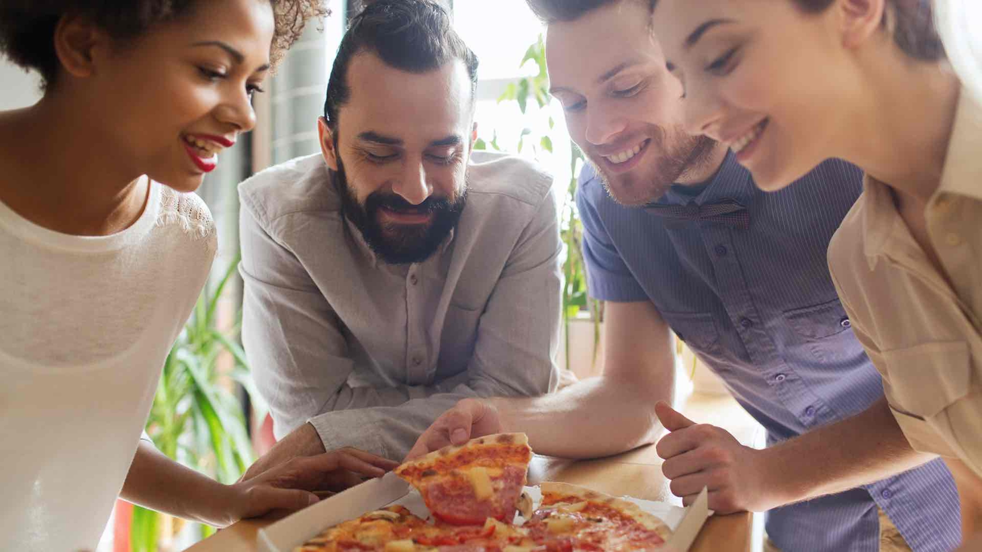 a group eating pizza
