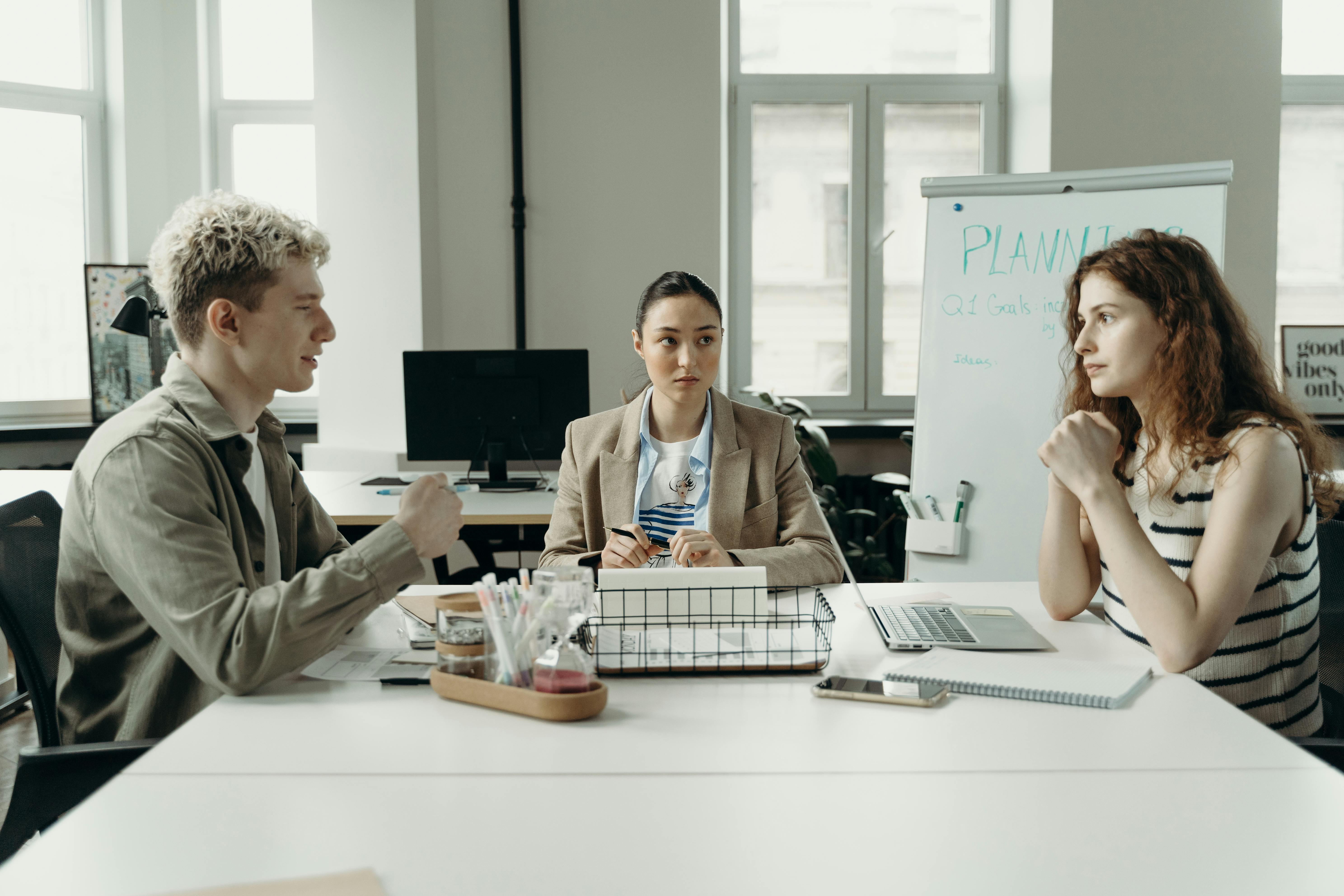 Woman consulting two advisors