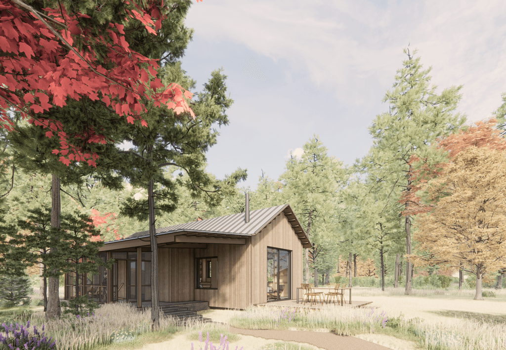 TMBR-designed single-family home with a timber exterior, nestled among trees, showcasing sustainable and modular construction.