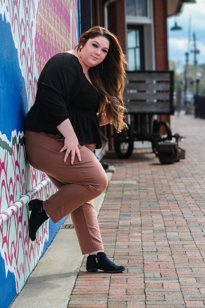 Self Portrait leaning against wall mural