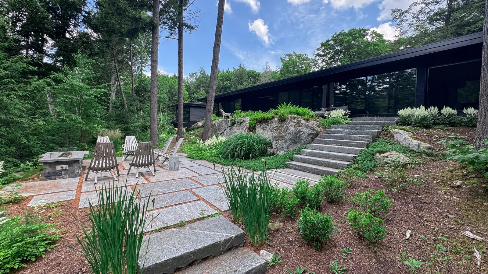 east lipsy lake haliburton luxury landscaping and stone stairs at mid century modern house.