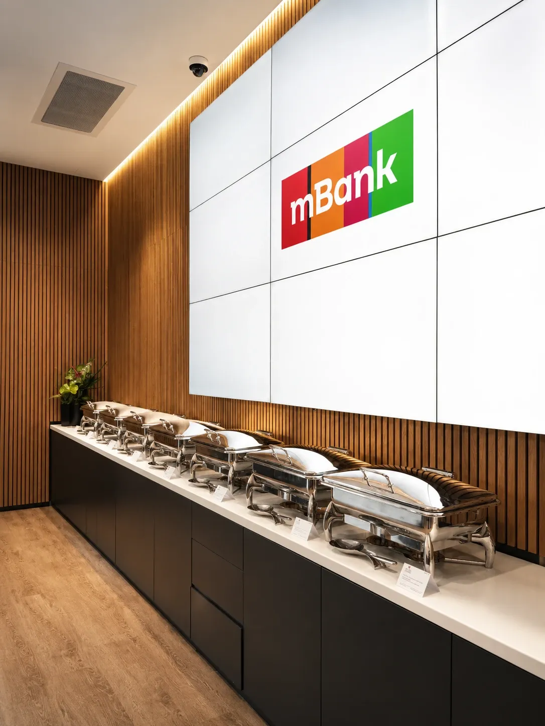 mBank conference for clients, lunch buffet in front of an LED wall with the mBank logo