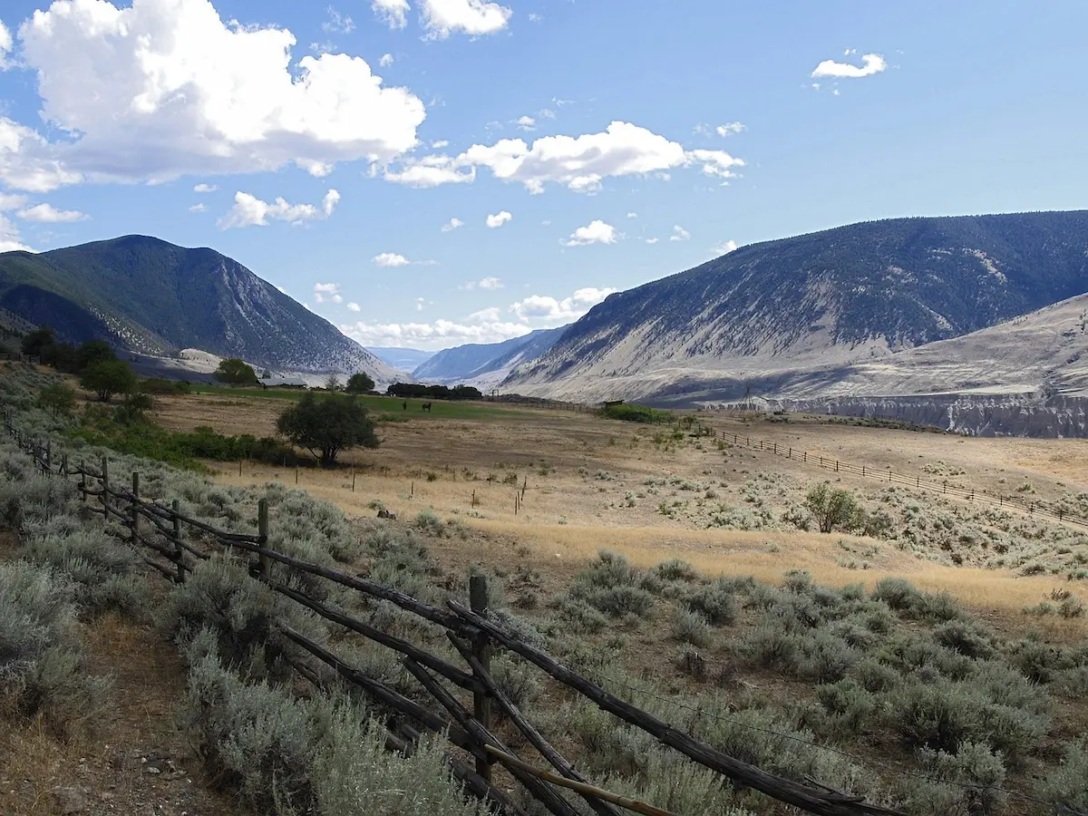 Landscape view of Rosedale, BC’s open valley and mountain ranges, representing the natural scenery where custom glass railings enhance outdoor living spaces.
