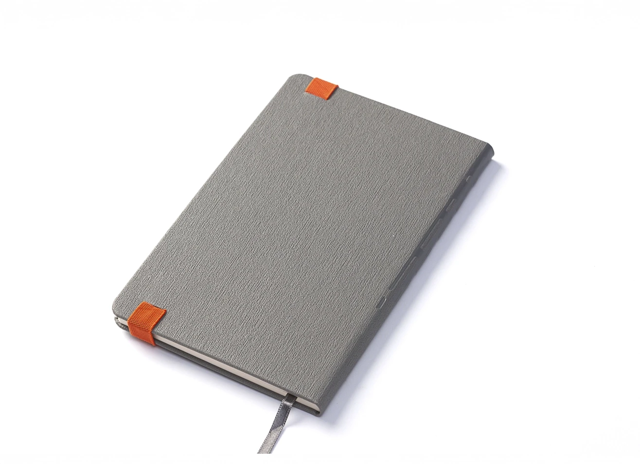 Back angled view of grey notebook showing orange elastic band details.