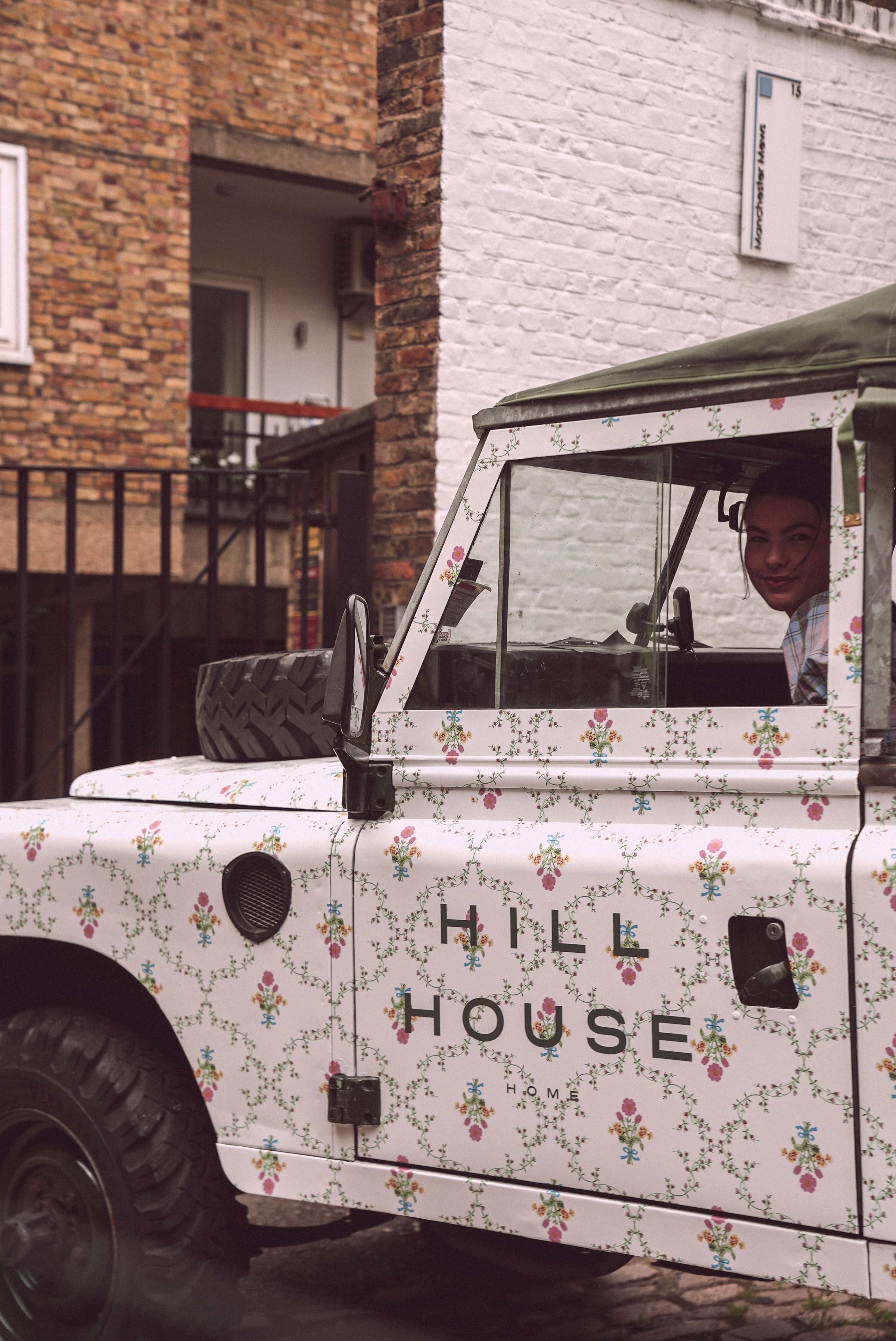 Couple embracing on street, bride's face obscured