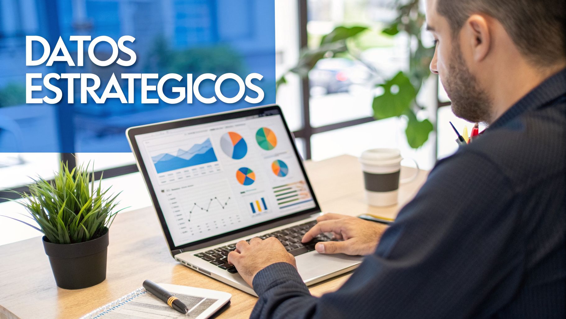 Hombre trabajando en una laptop con gráficos de datos estratégicos en pantalla, en un ambiente de oficina.