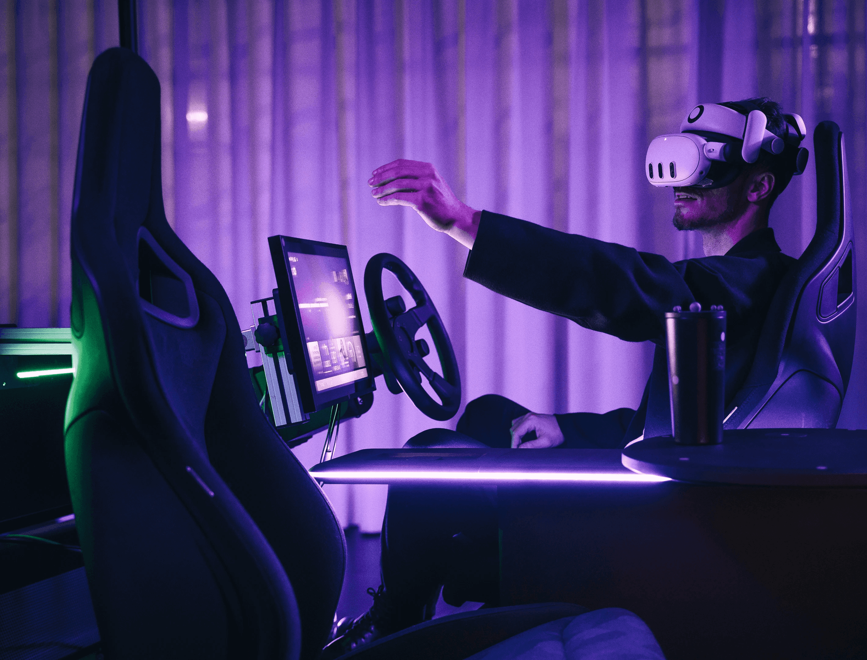 Man in VR headset interacting with a simulation, representing integrated automotive, UX, & industrial design by a multidisciplinary design studio in Turin.