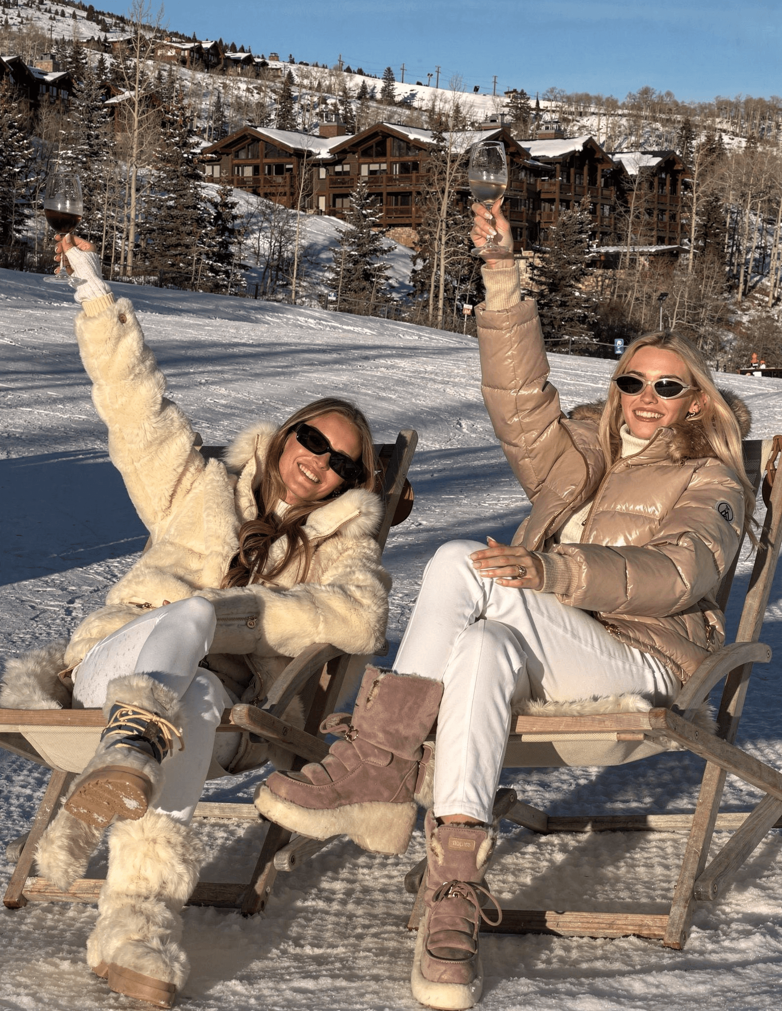 Two women celebrating at luxury ski resort
