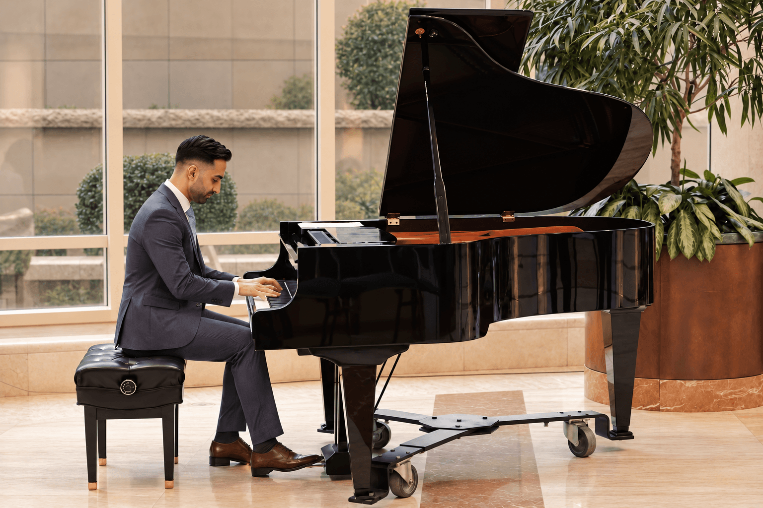 Dr. Khaled O. Alameddine playing a grand piano