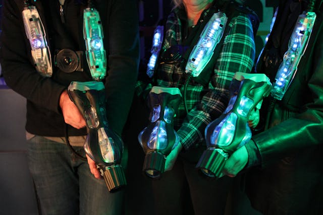 Peopleshow off their gear and equipment for Laser tag.