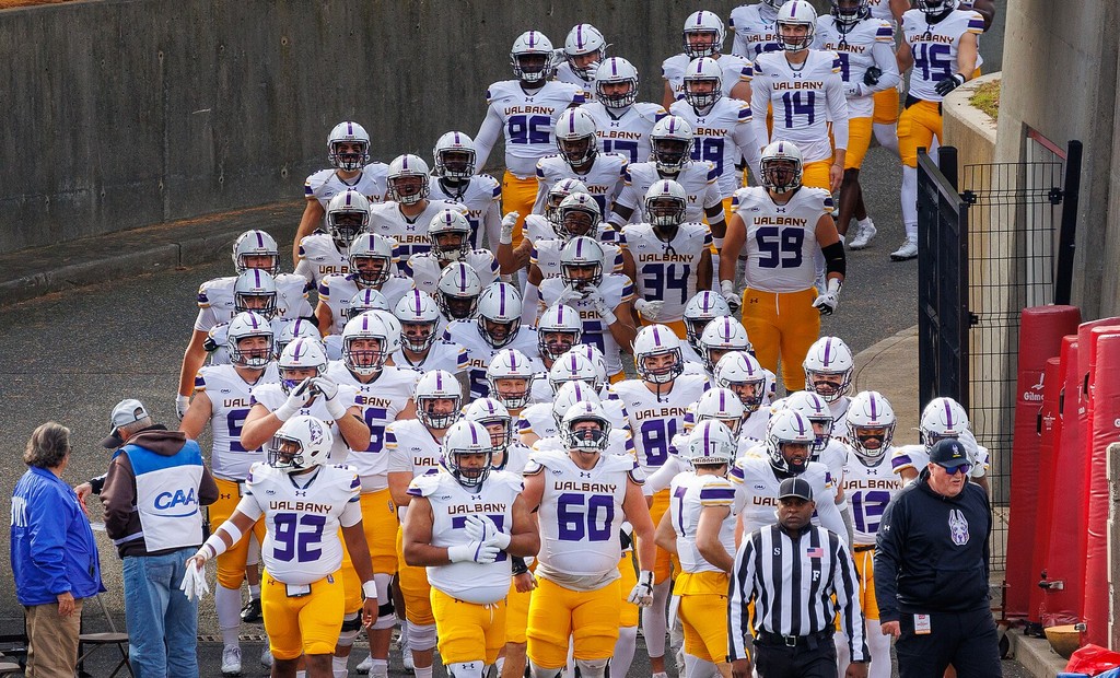 Albany Great Danes players enter Kenneth P LaValle Stadium at Stony Brook for a football game FCS