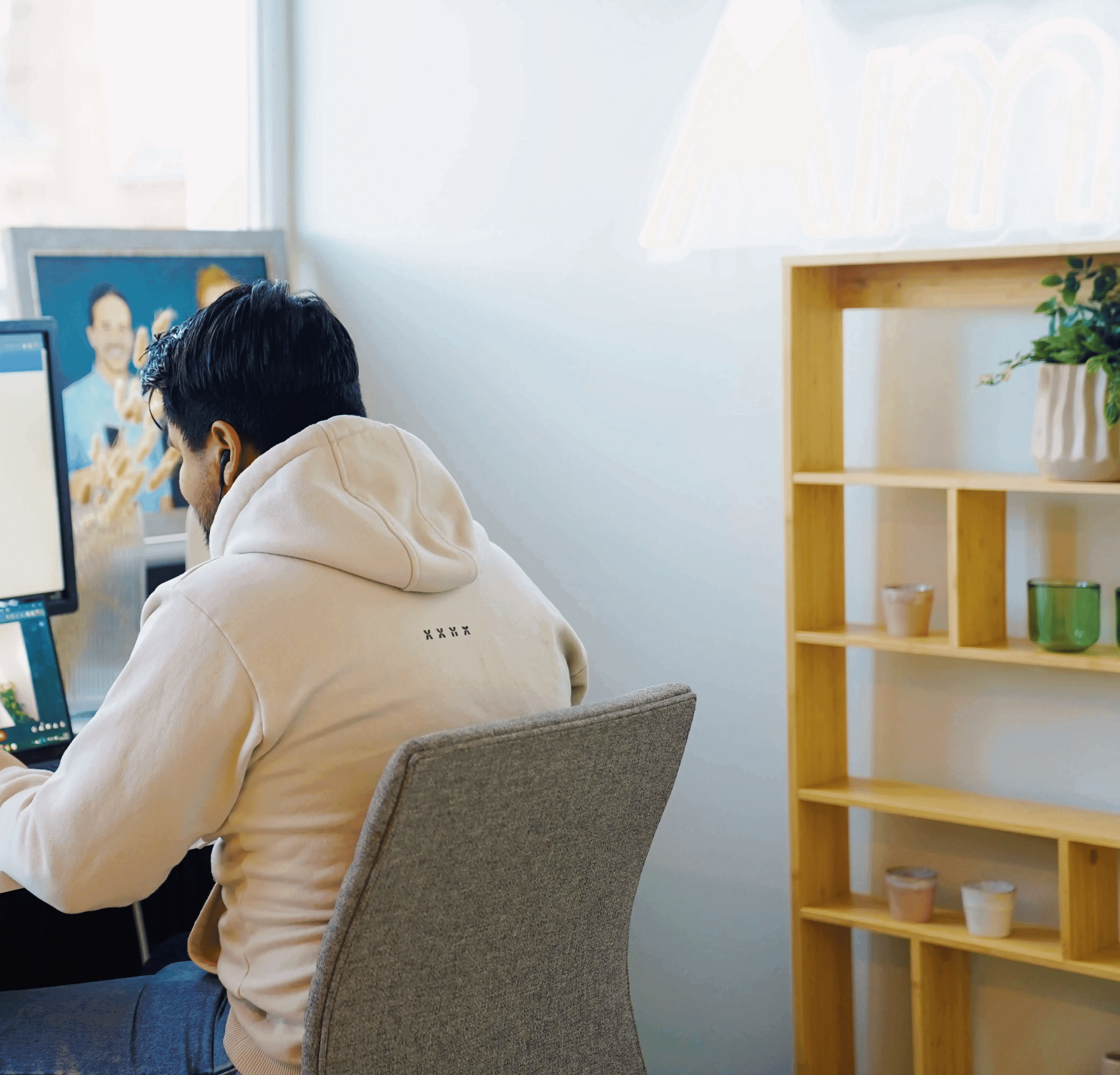 Man working on computer at office desk for recruiters highlighting productivity