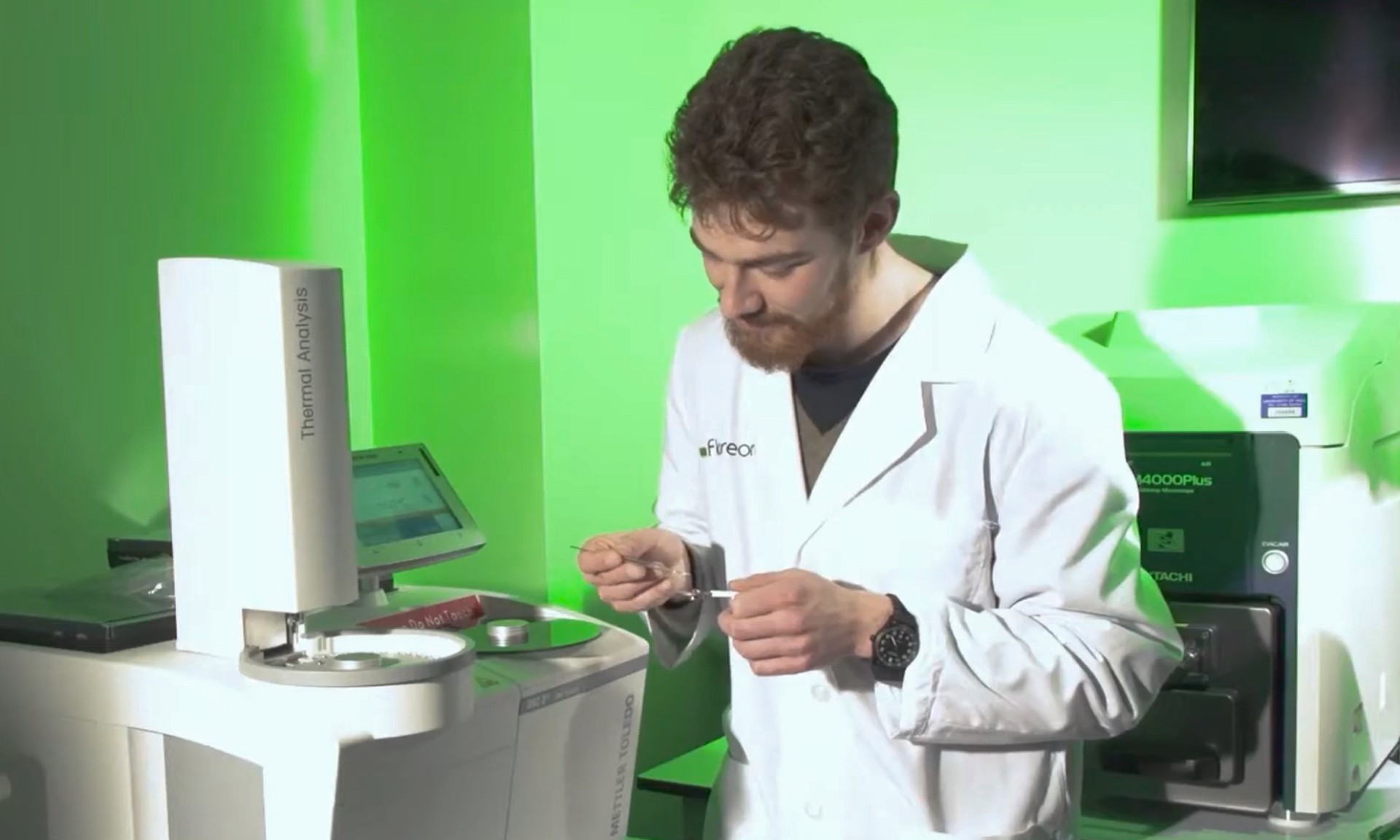 A photo of a man in a lab conducting a thermal analysis experiment
