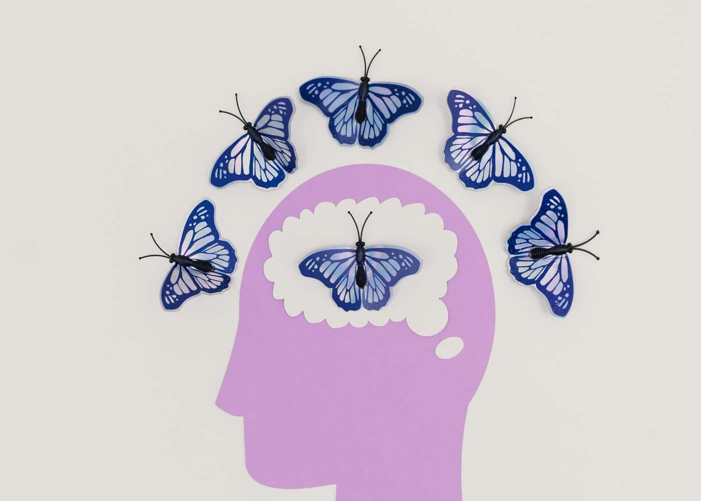 Psychobiotics - fiagram of a brain surrounded by butterflies