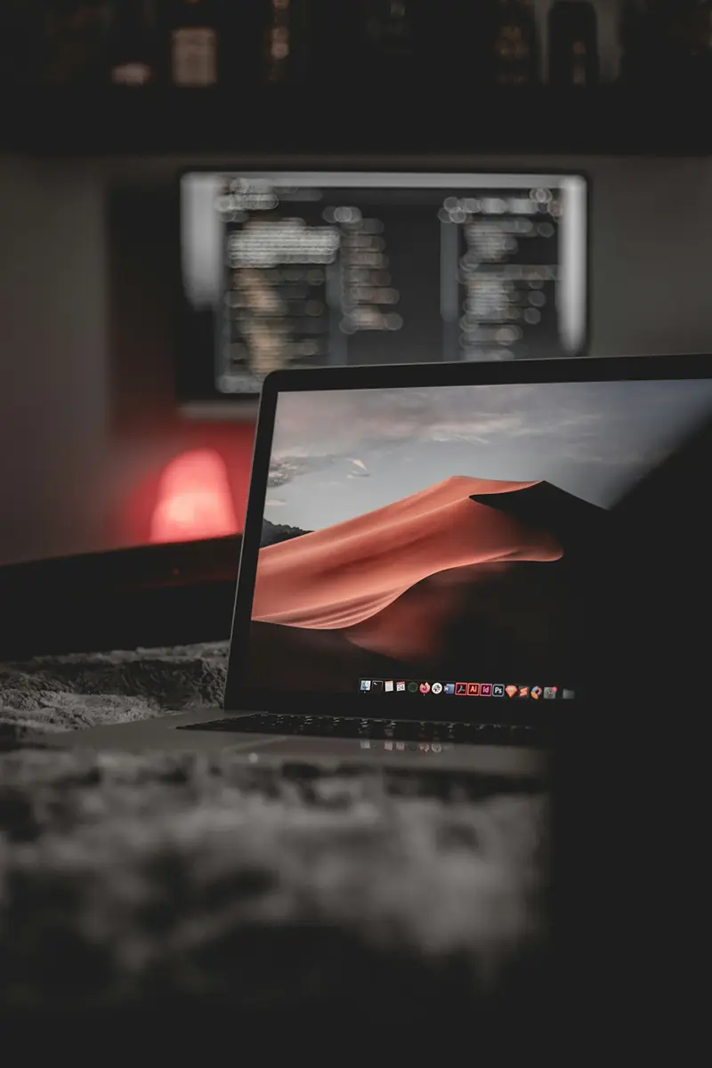 Laptop on a bed, creating a relaxed remote work setup