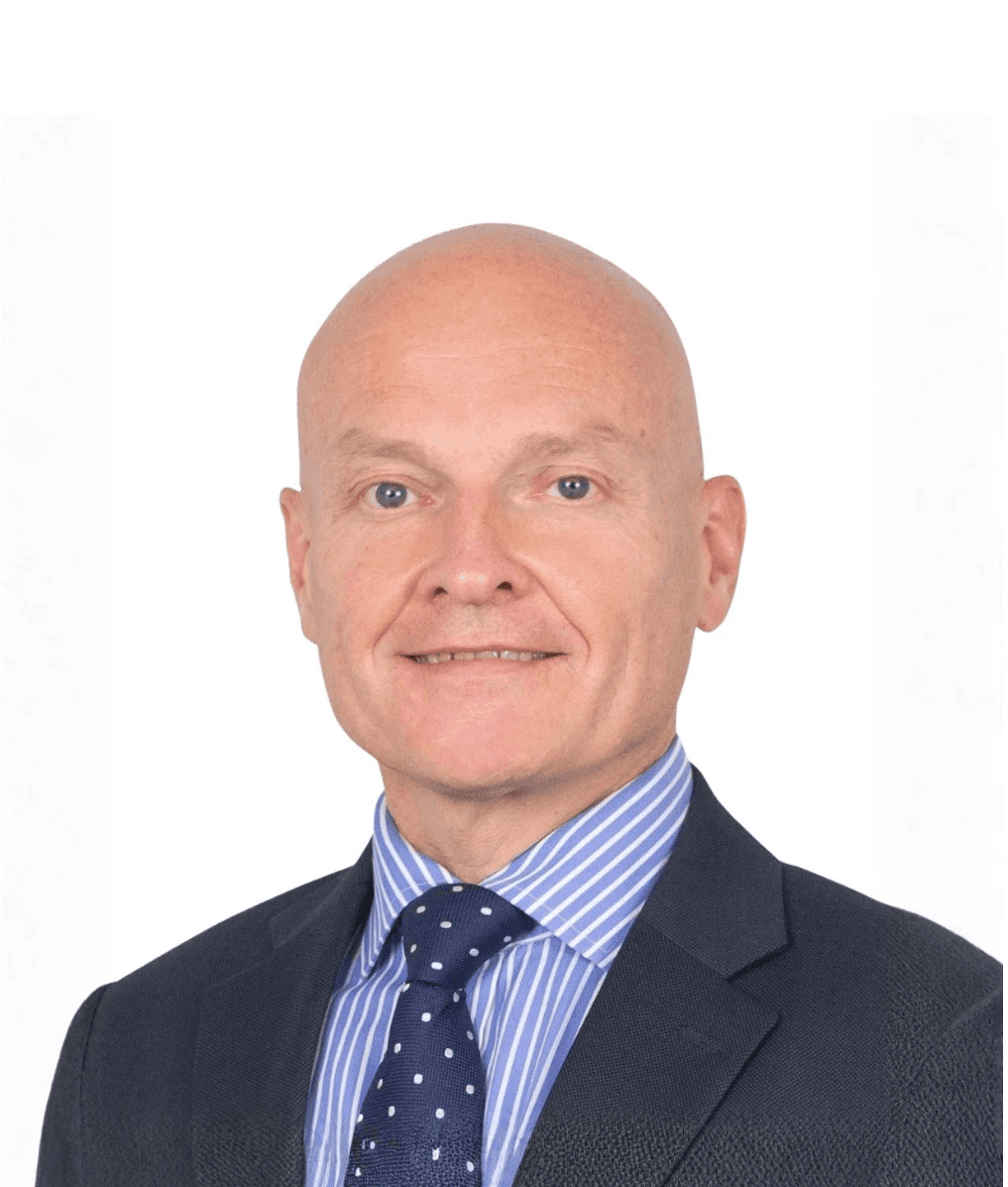 man standing beside wall