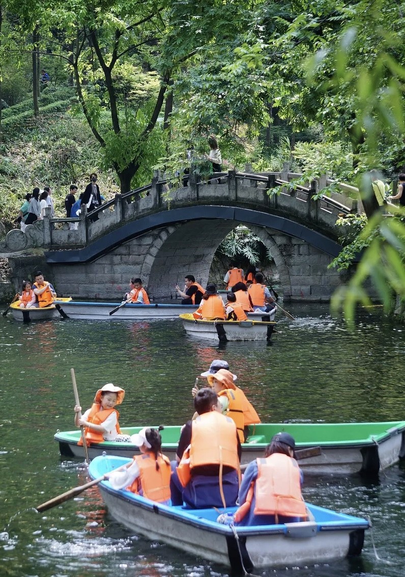 Tourists rowing boats on the lake in Chengdu People's Park