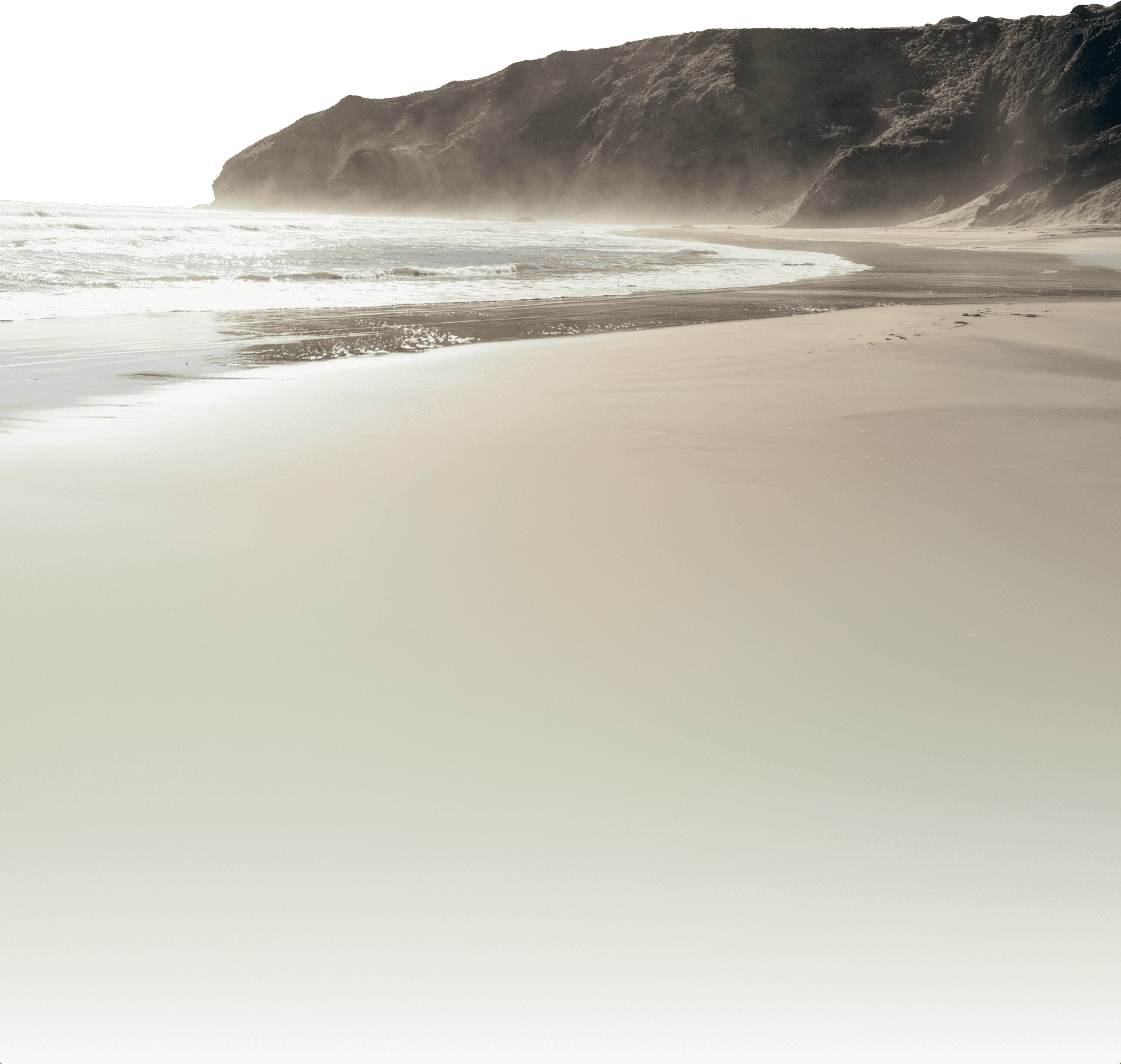 image of a beach with smooth white sand and a small hill in the background