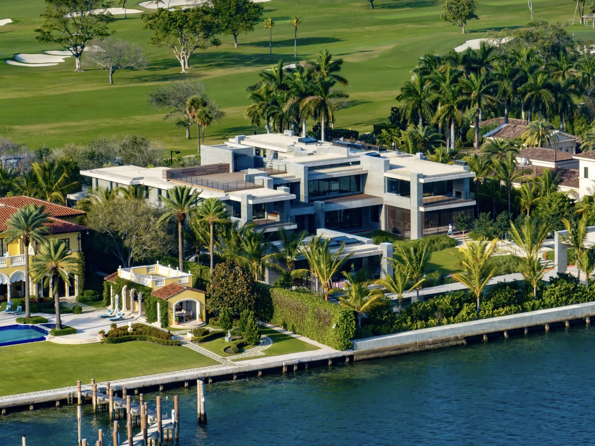 Contemporary residence with palms and landscaped grounds, architectural reference photograph
