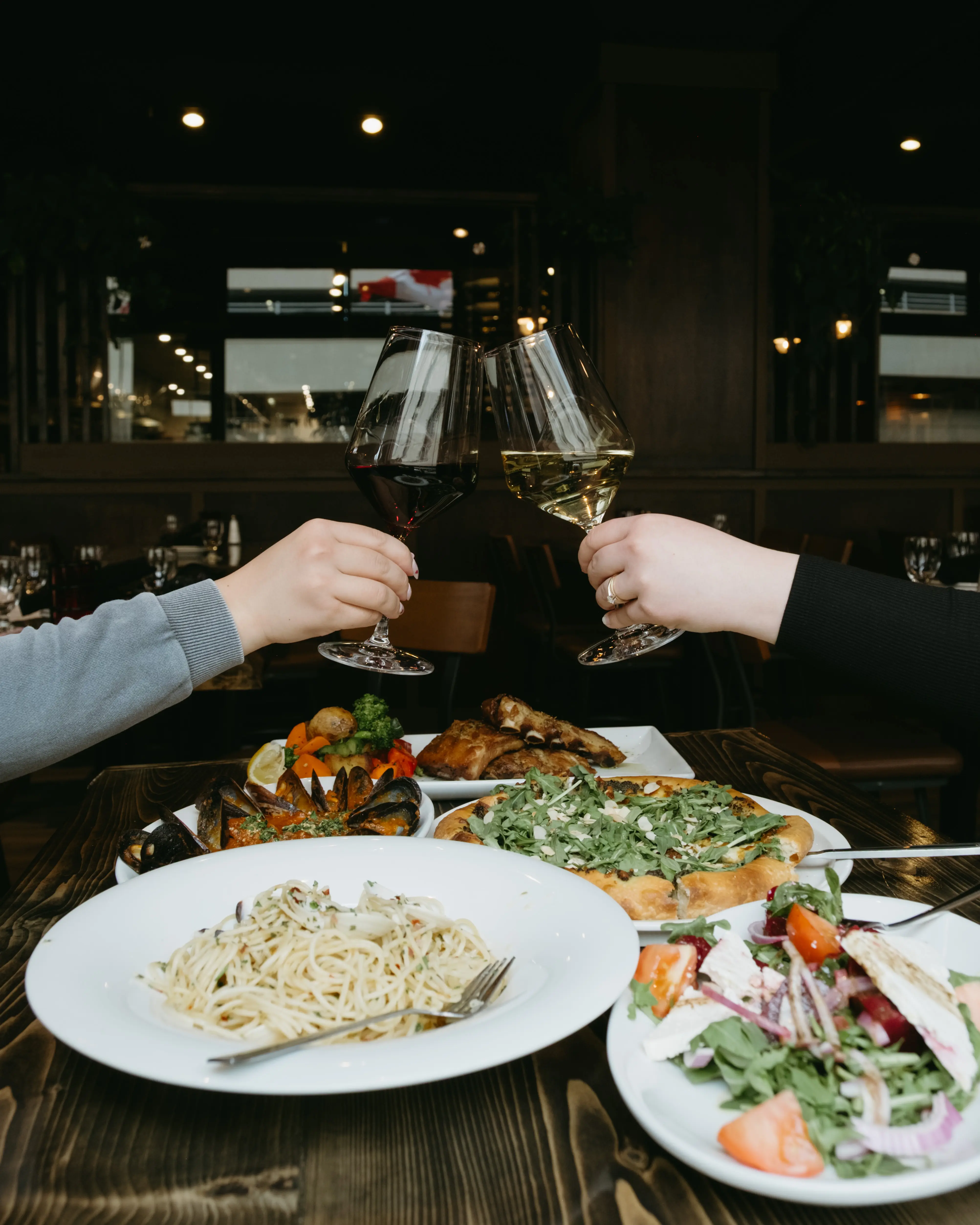 Happy hour at Toscana Italian Grill Calgary with wine, pizza, and seafood specials