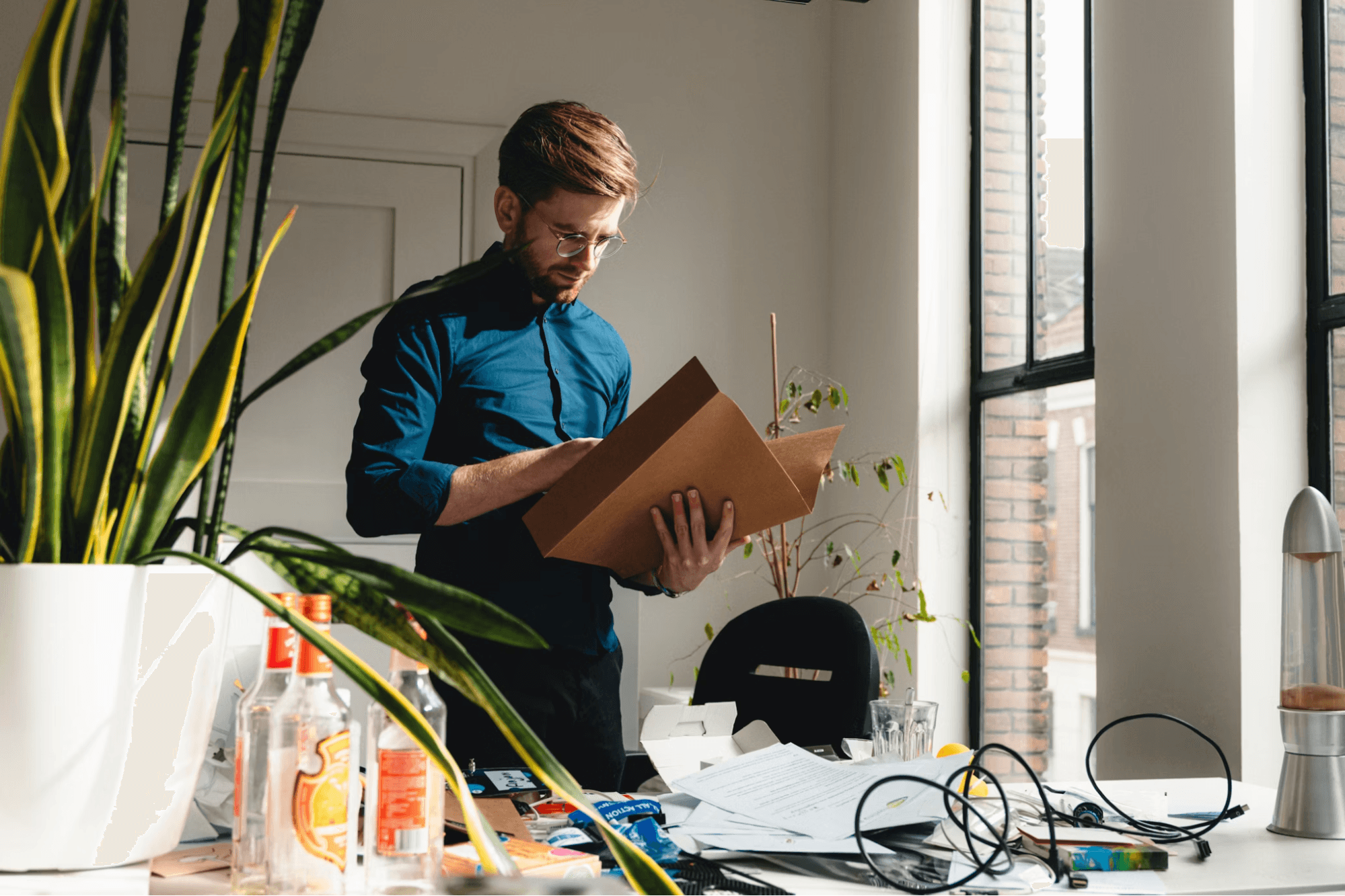 Man in an office reviewing documents, representing bookkeeping tasks for a divorce law firm.