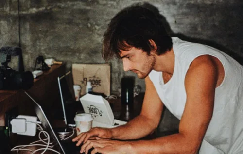 Moos working behind a laptop