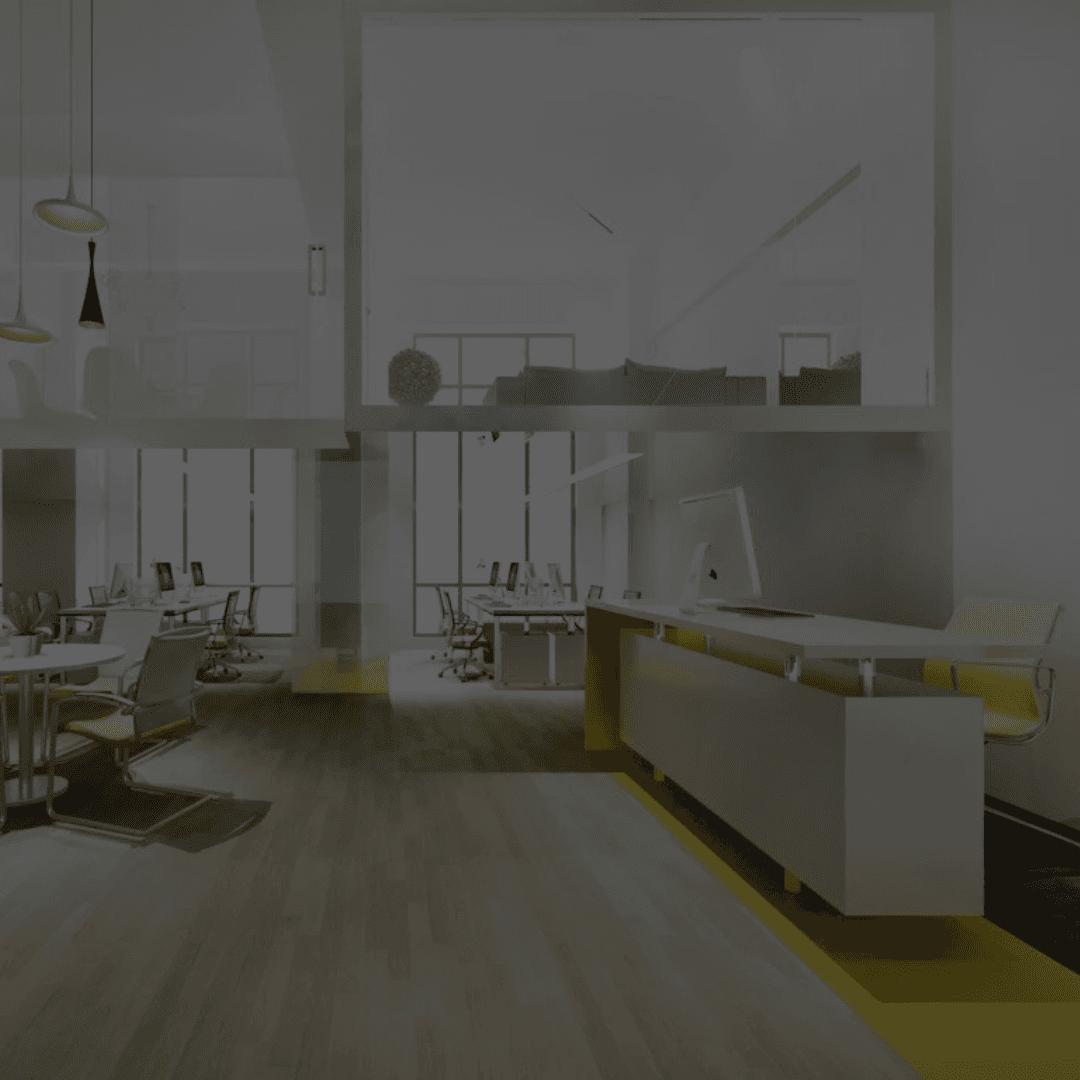 Bright and modern office space renovation with open-concept layout, sleek white desks, and stylish lighting designed by B&Y Reno Corp