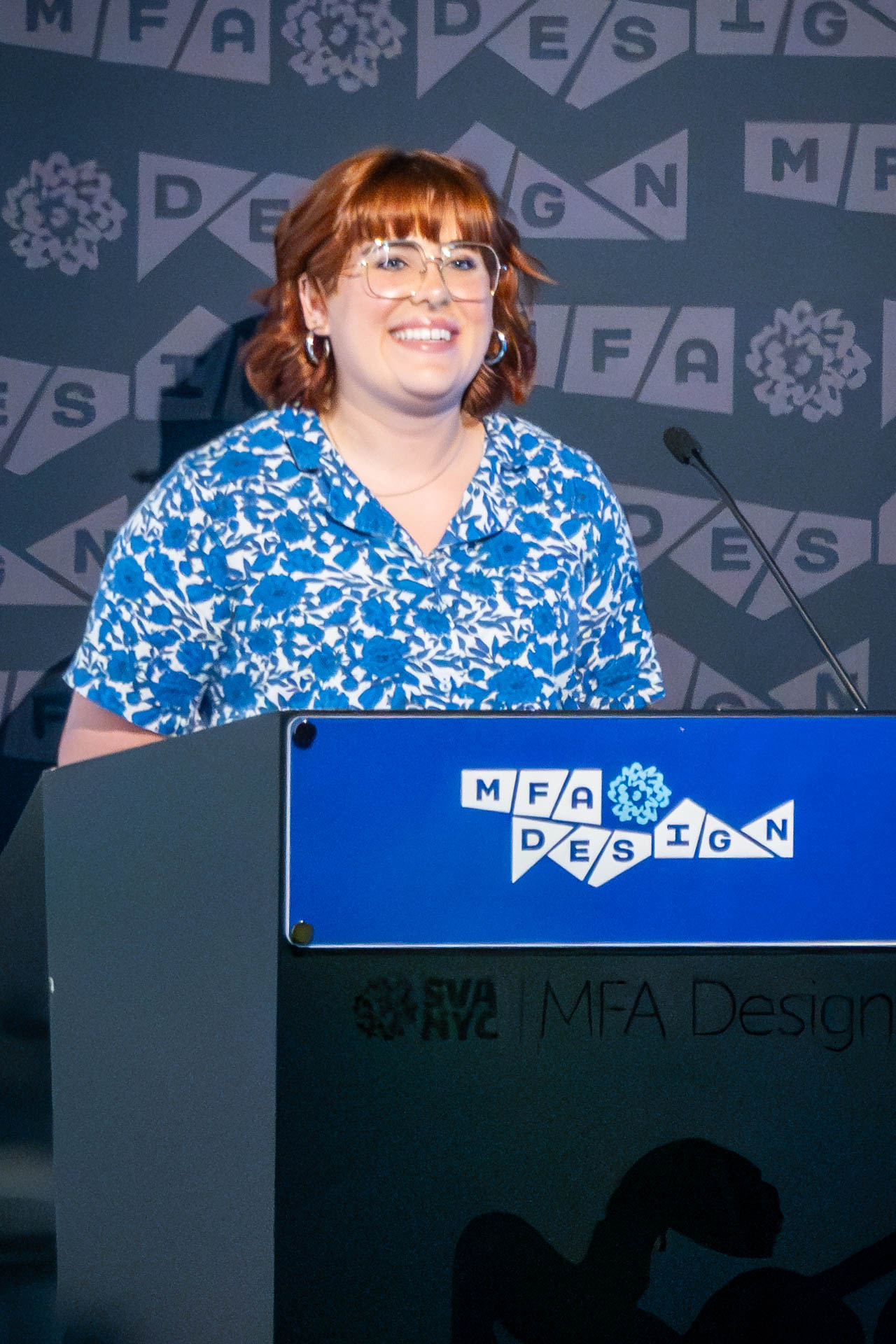 student at a podium giving a presentation