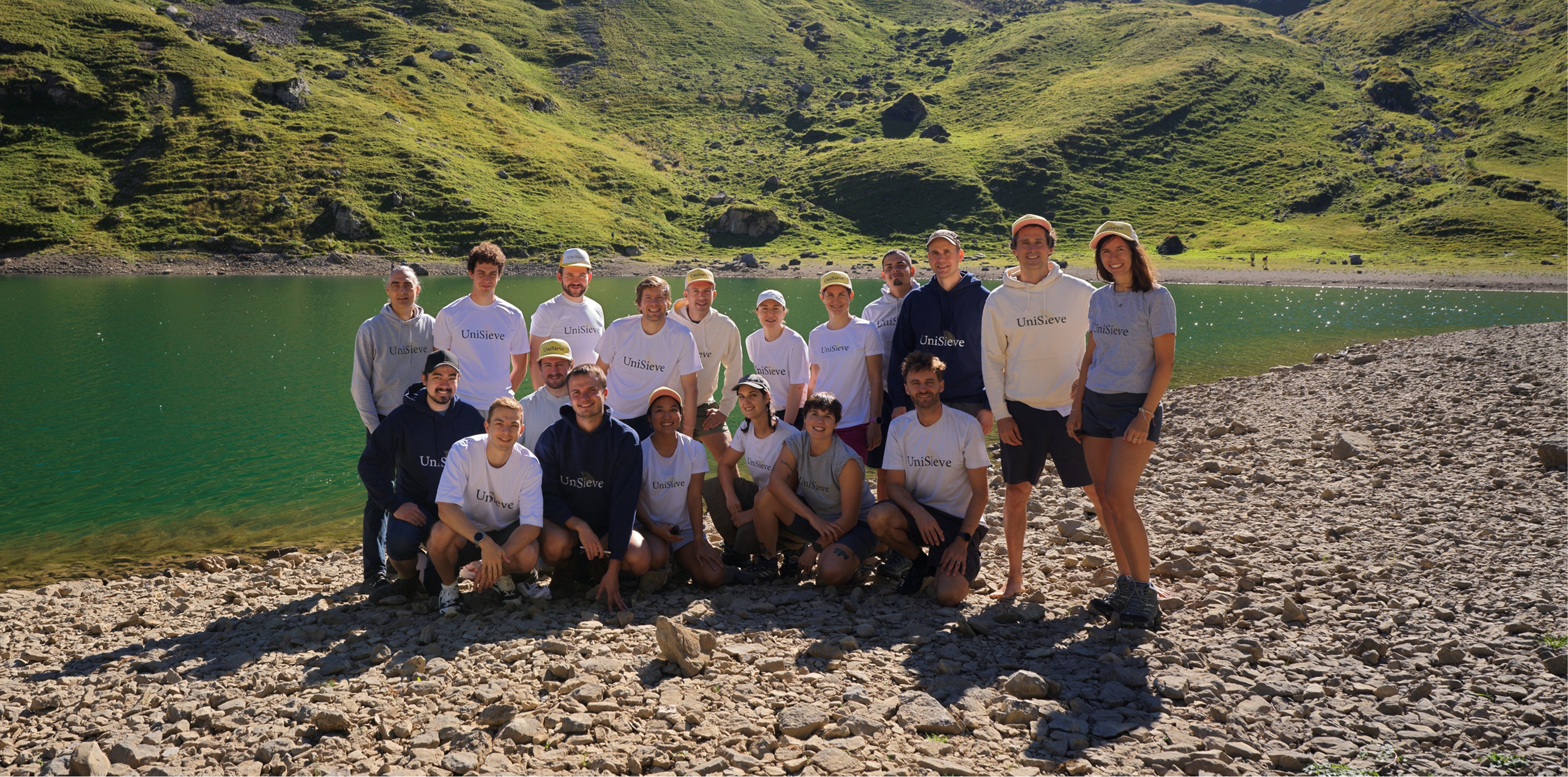 UniSieve team gathered beside an alpine lake