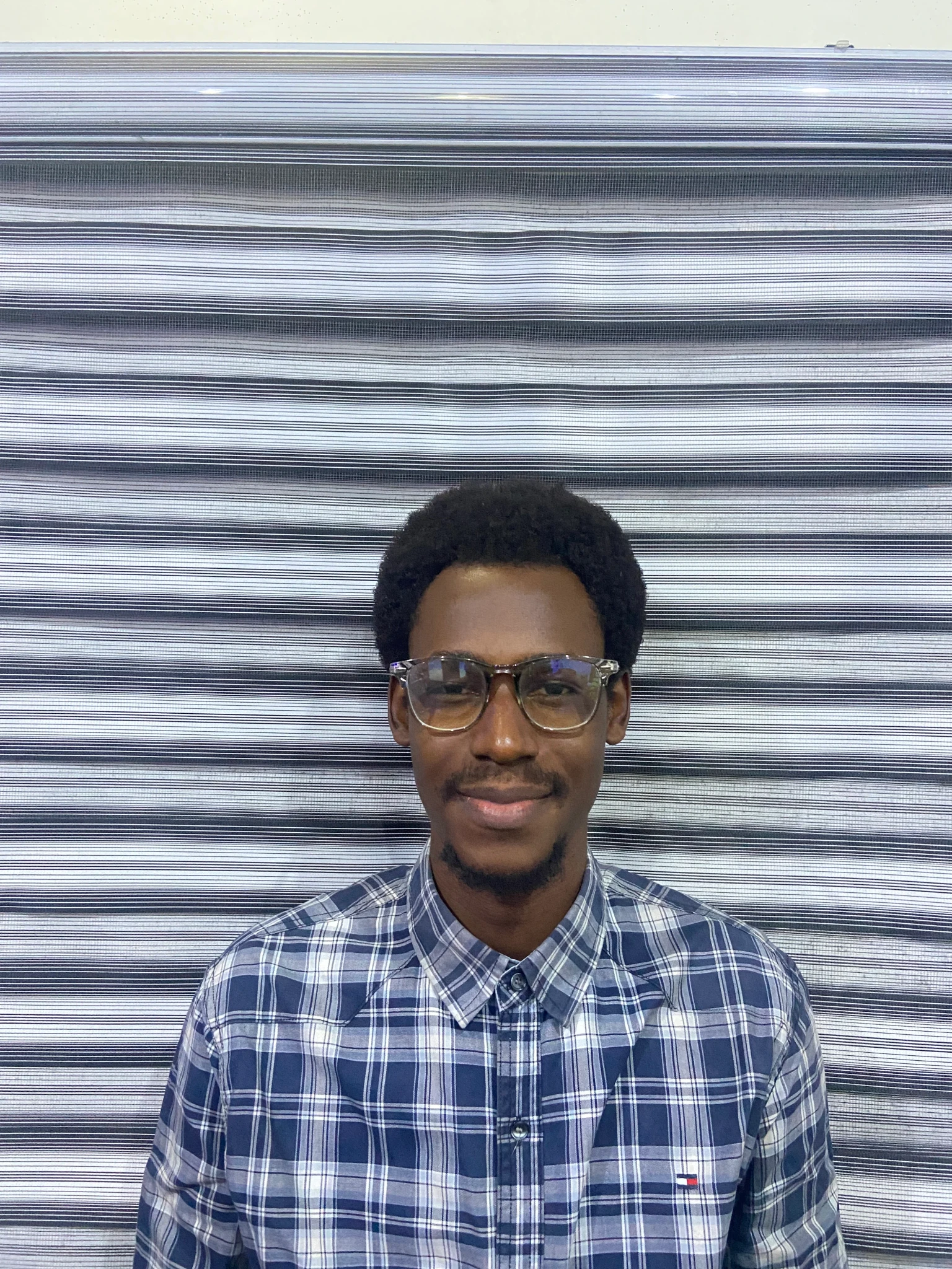 A headshot of me, smiling and being a nerd — nothing new