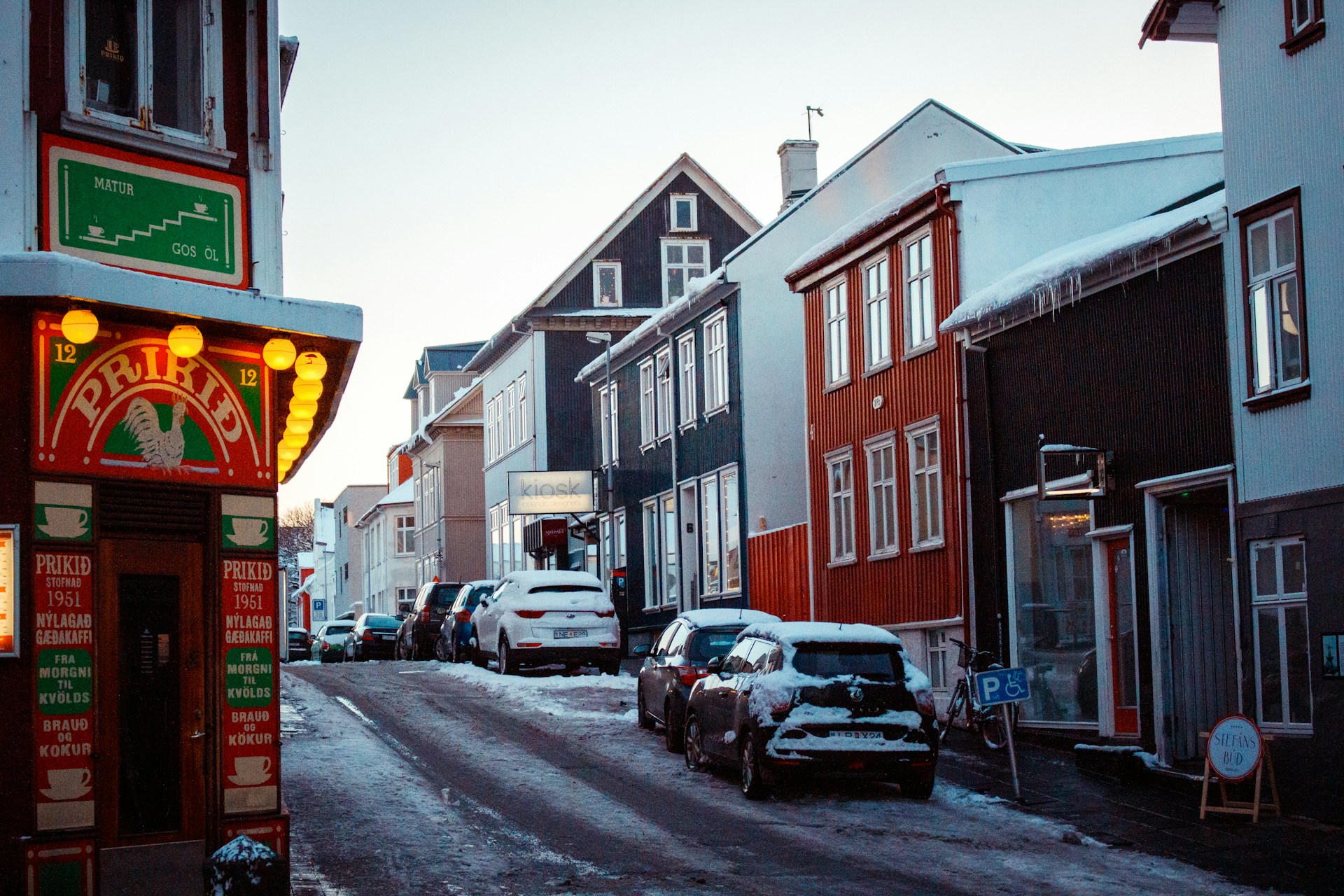 Snow-covered street with Prikið Café near Kvosin Hotel in downtown Reykjavík.